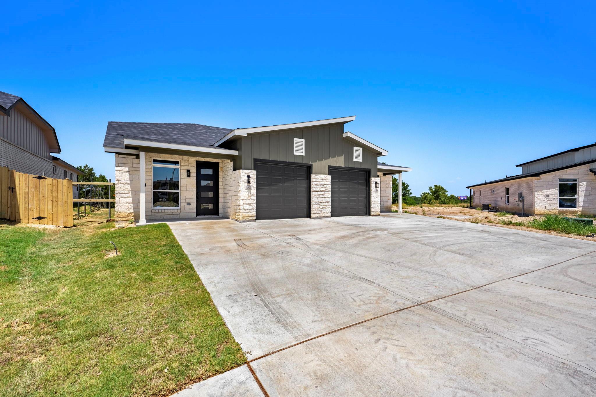A newly constructed modern dwelling presents a cl