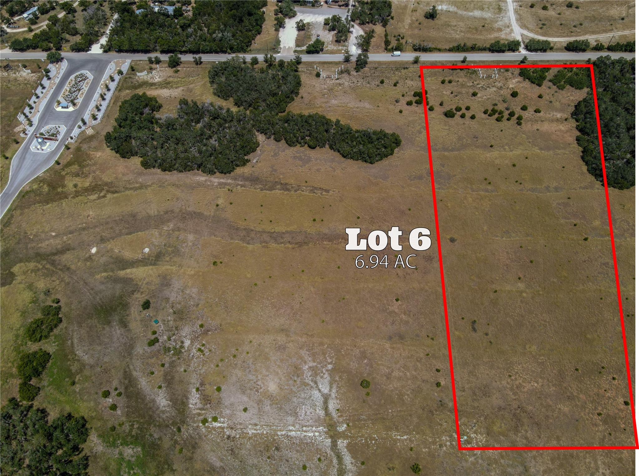 A sprawling 6.94-acre lot offers abundant space f