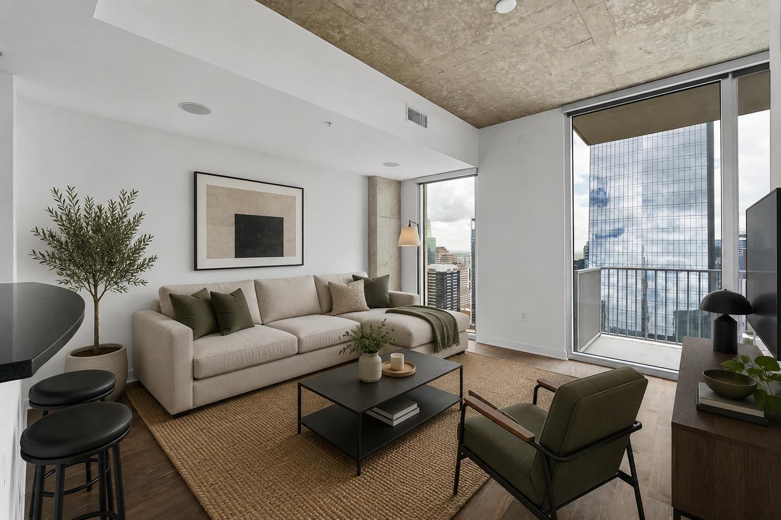 City views frame this inviting living room, featu