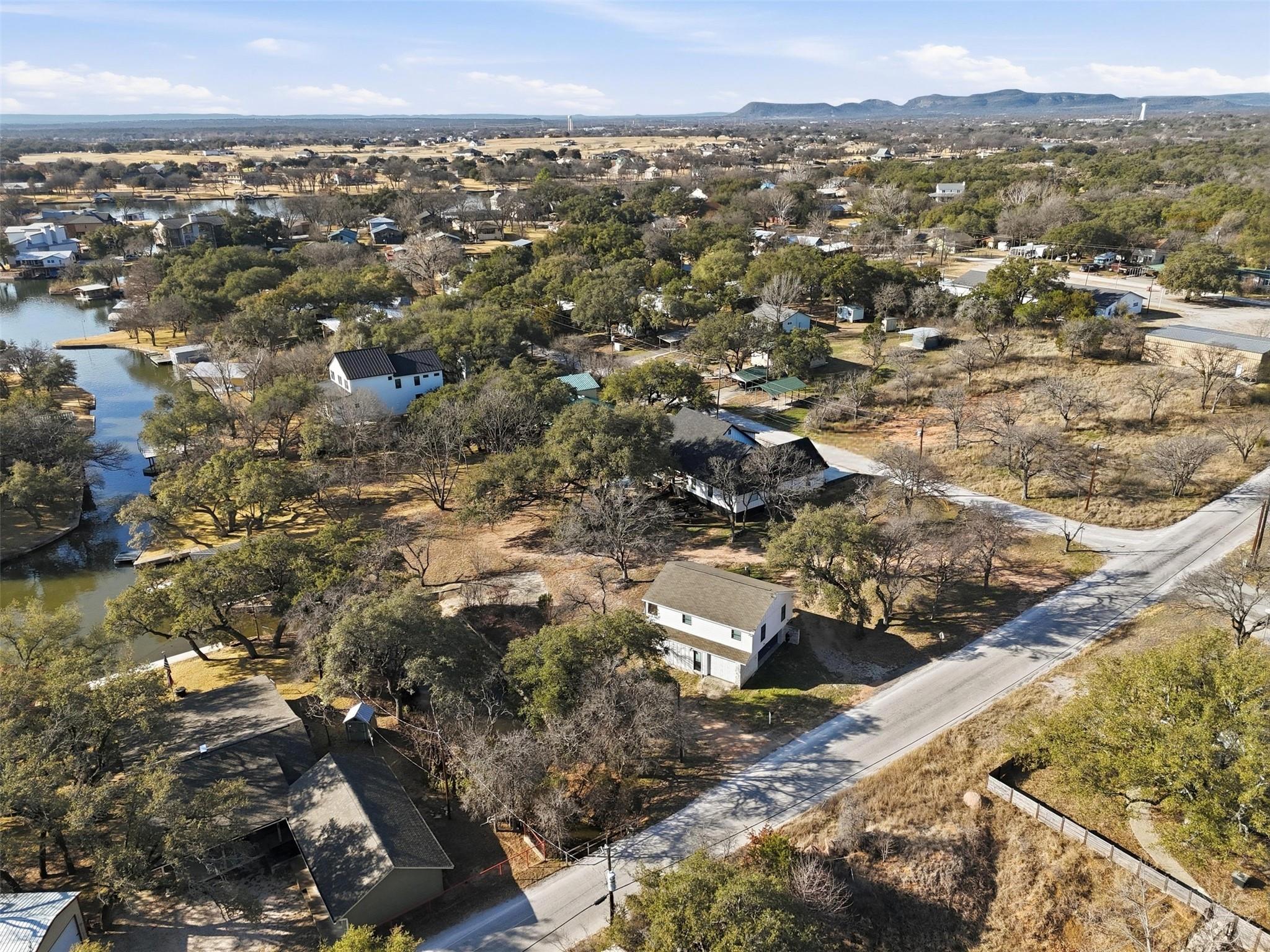 An aerial panorama reveals a waterfront community
