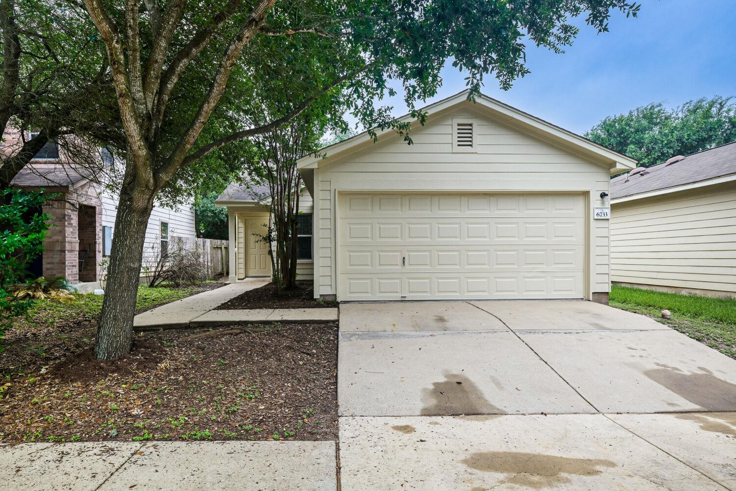 A classic facade with an attached garage offers i