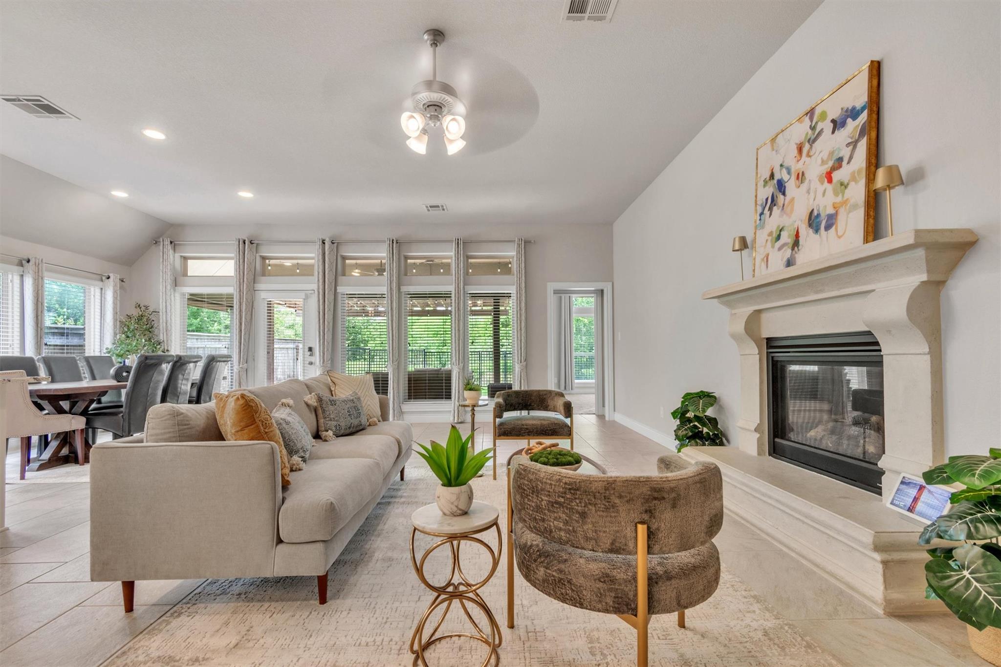 A refined living area featuring a stately firepla
