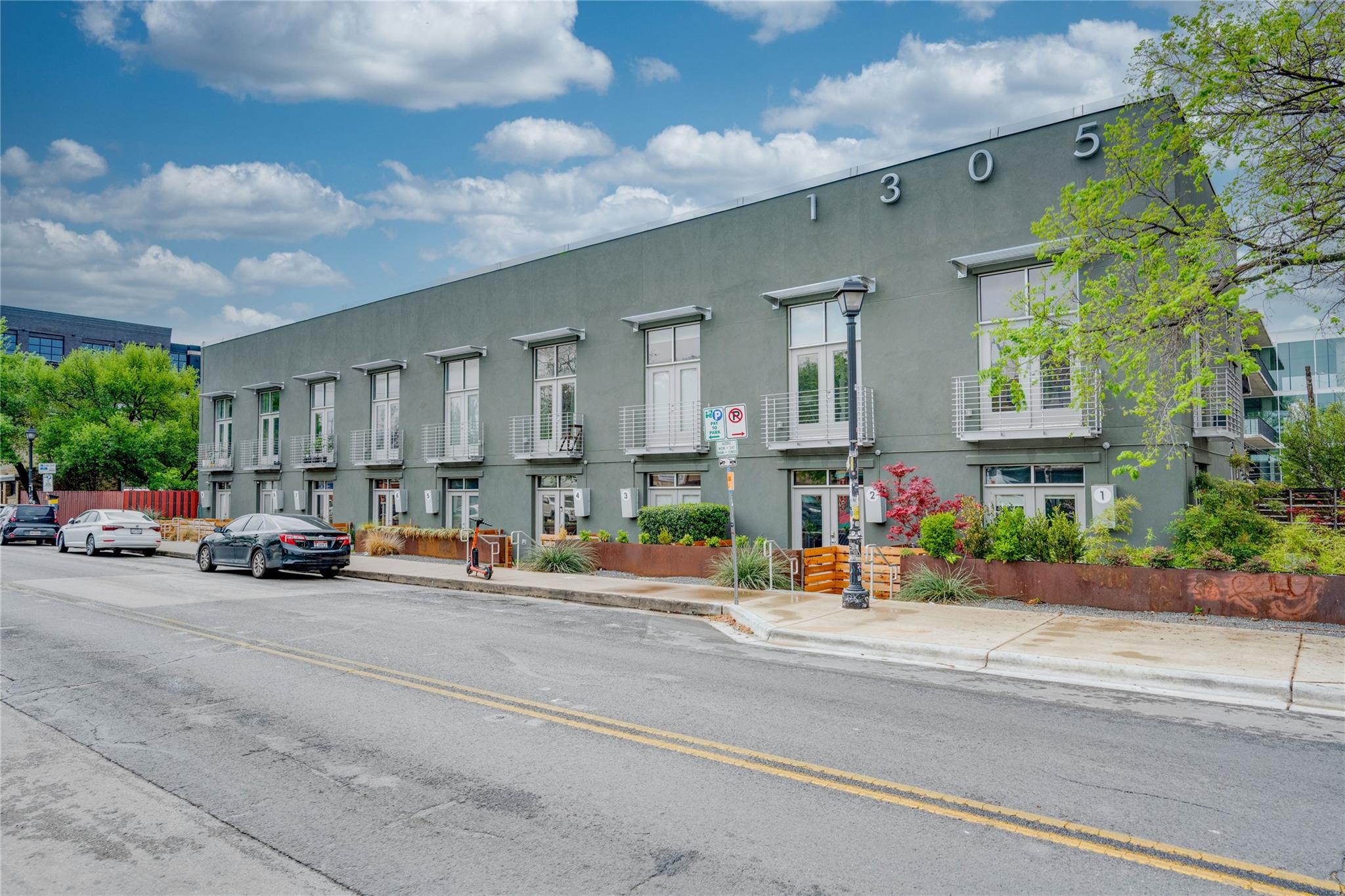 Modern mixed-use building with individual balconi