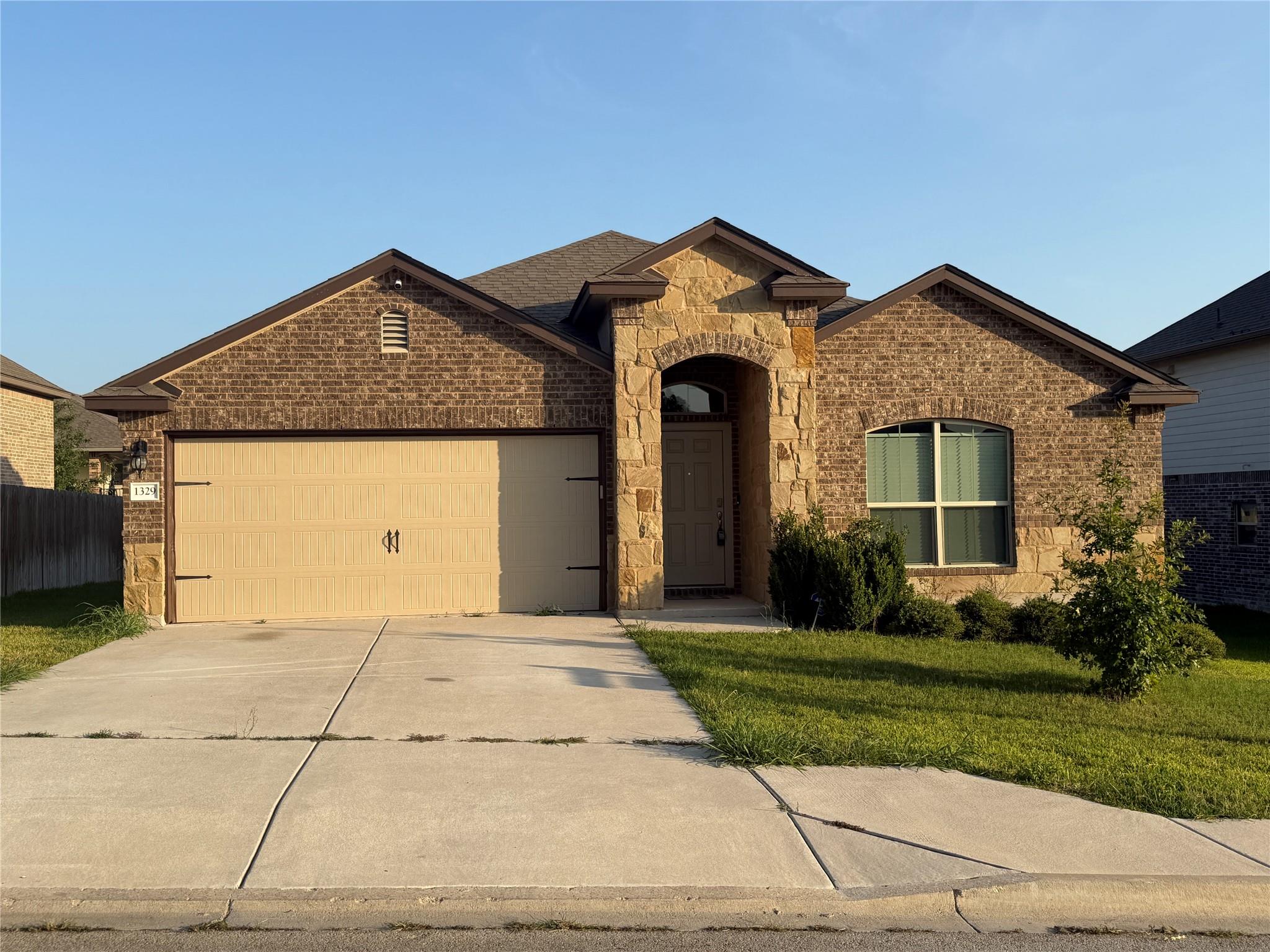 A welcoming facade with a charming stone and bric