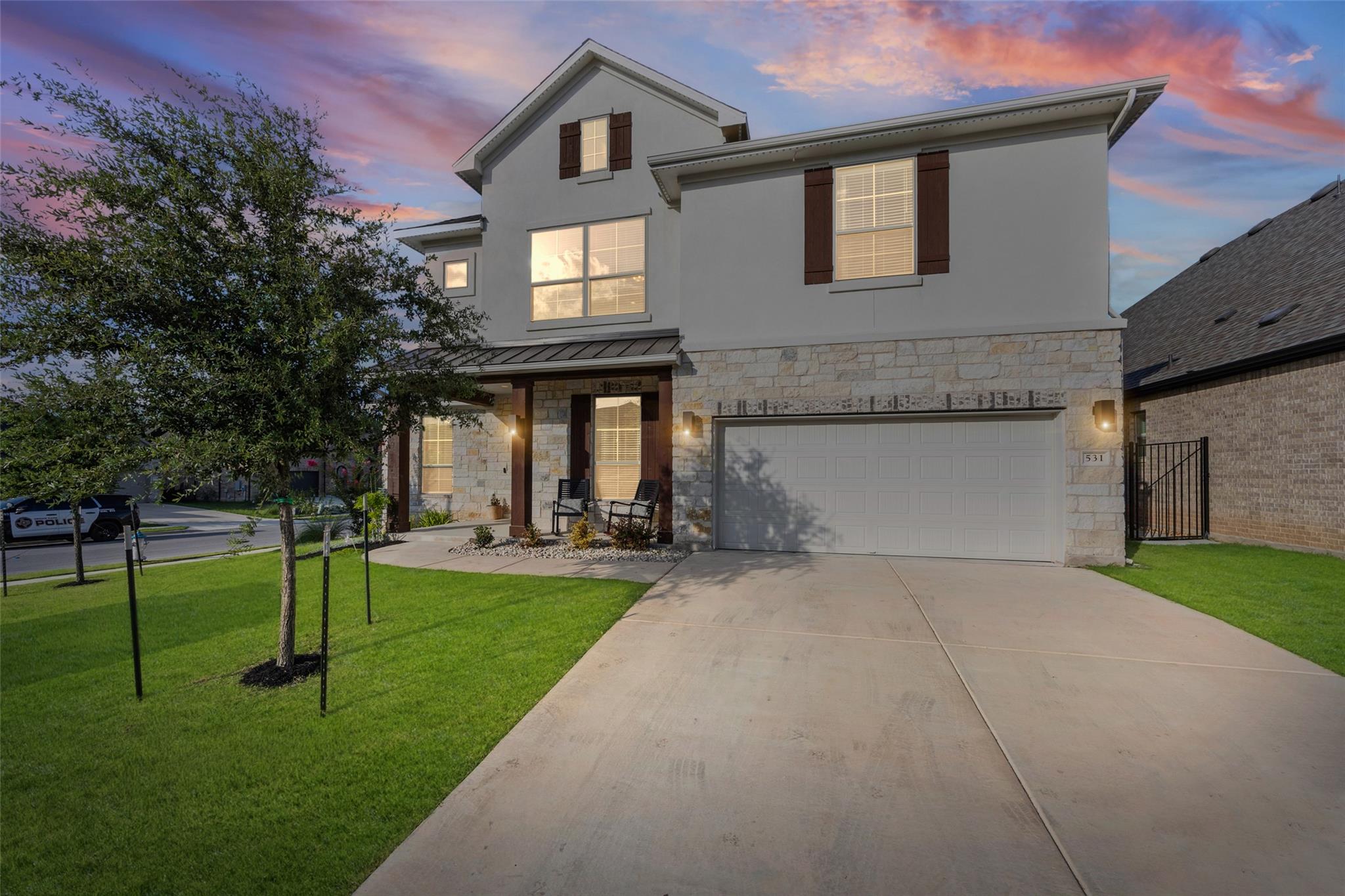 A welcoming stone and stucco facade greets you, f