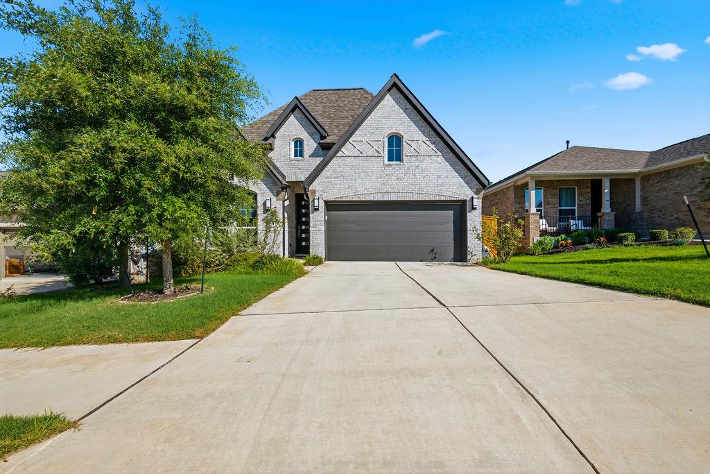 A grand entrance with an attached garage and expa