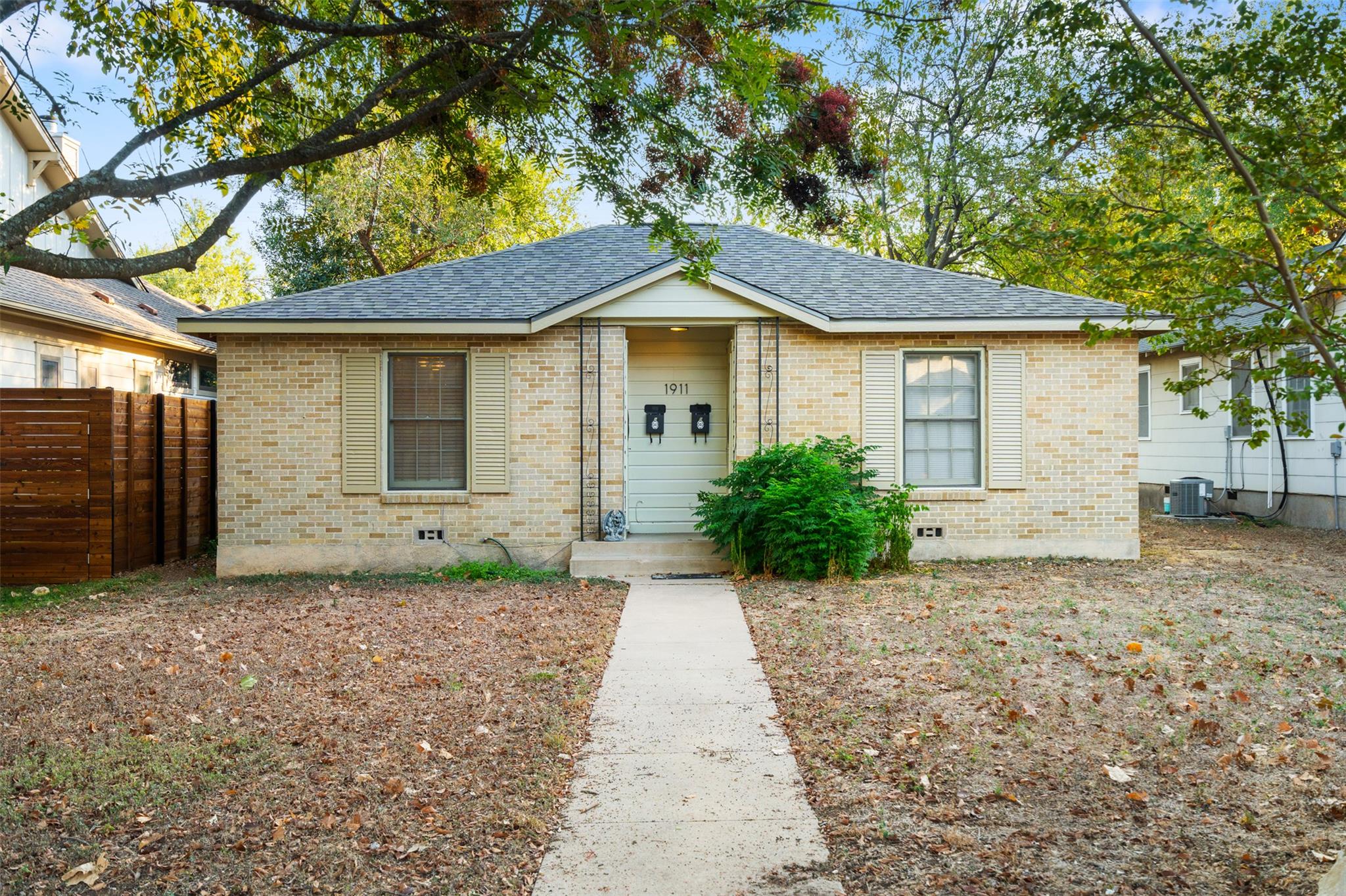 A classic brick bungalow with a welcoming front p