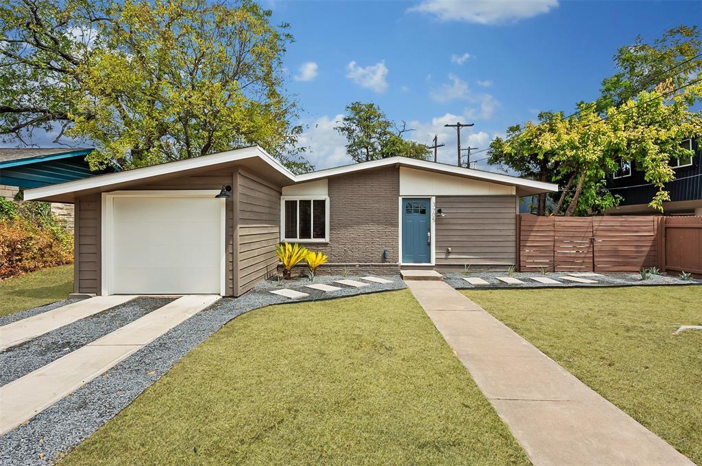 A striking modern exterior features a welcoming b