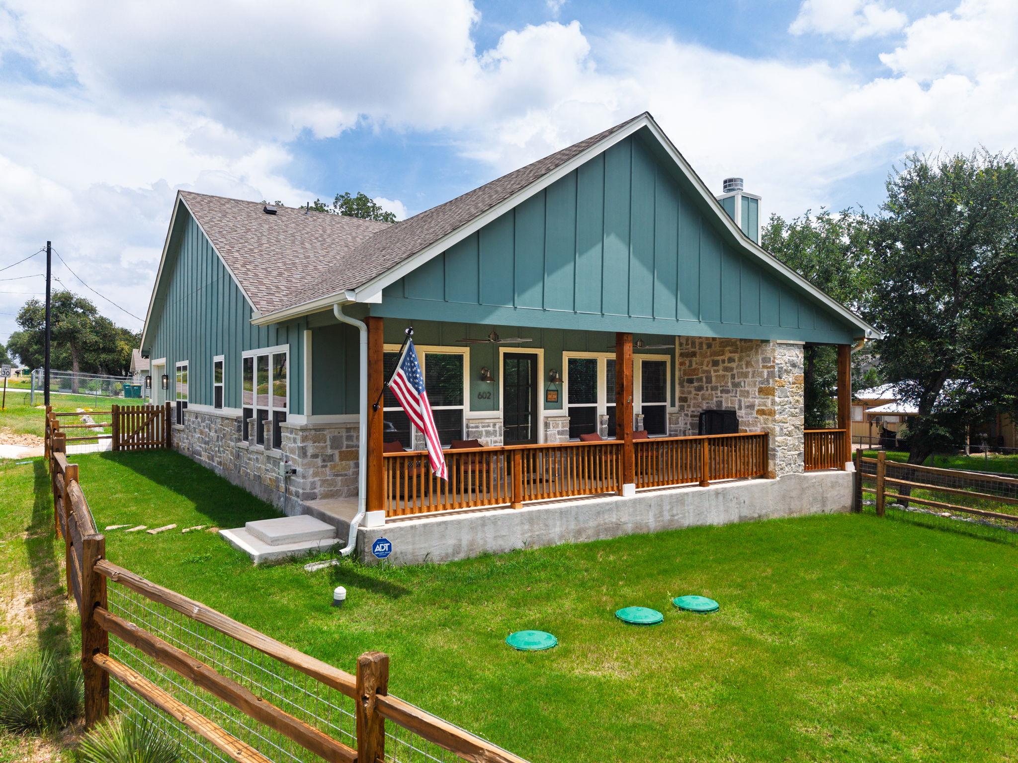 A welcoming stone and siding facade offers curb a