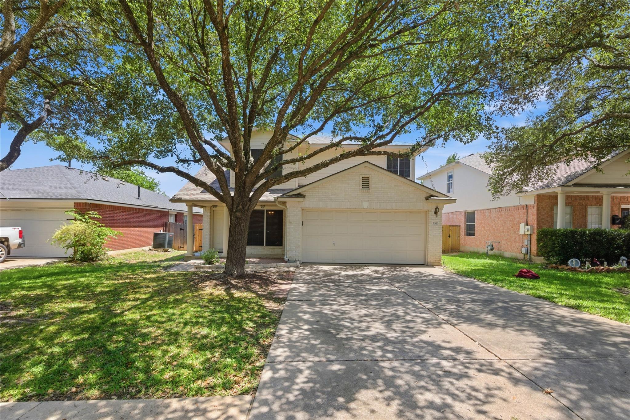 A classic facade with a spacious driveway invites