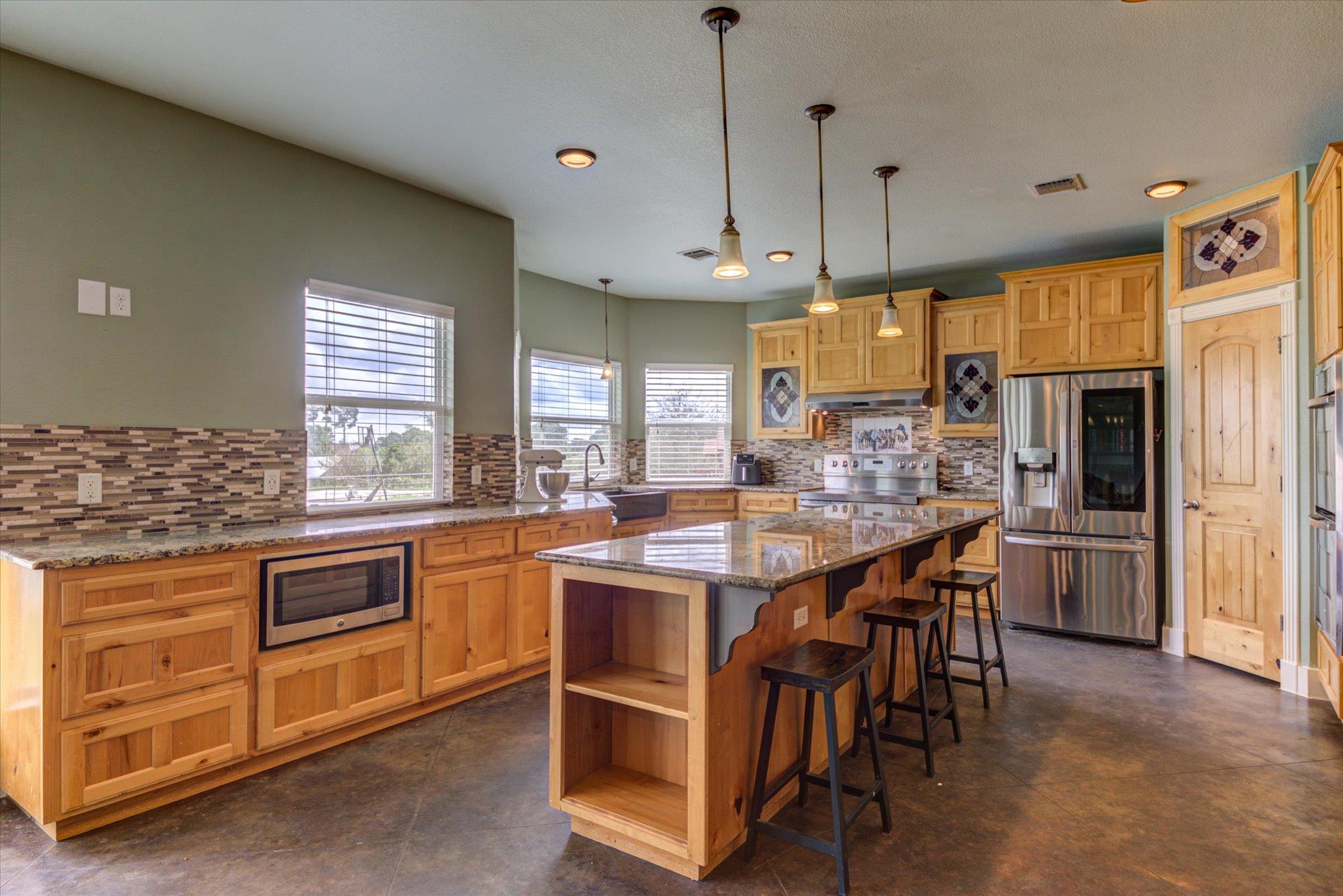 A well-appointed kitchen showcasing an island wit