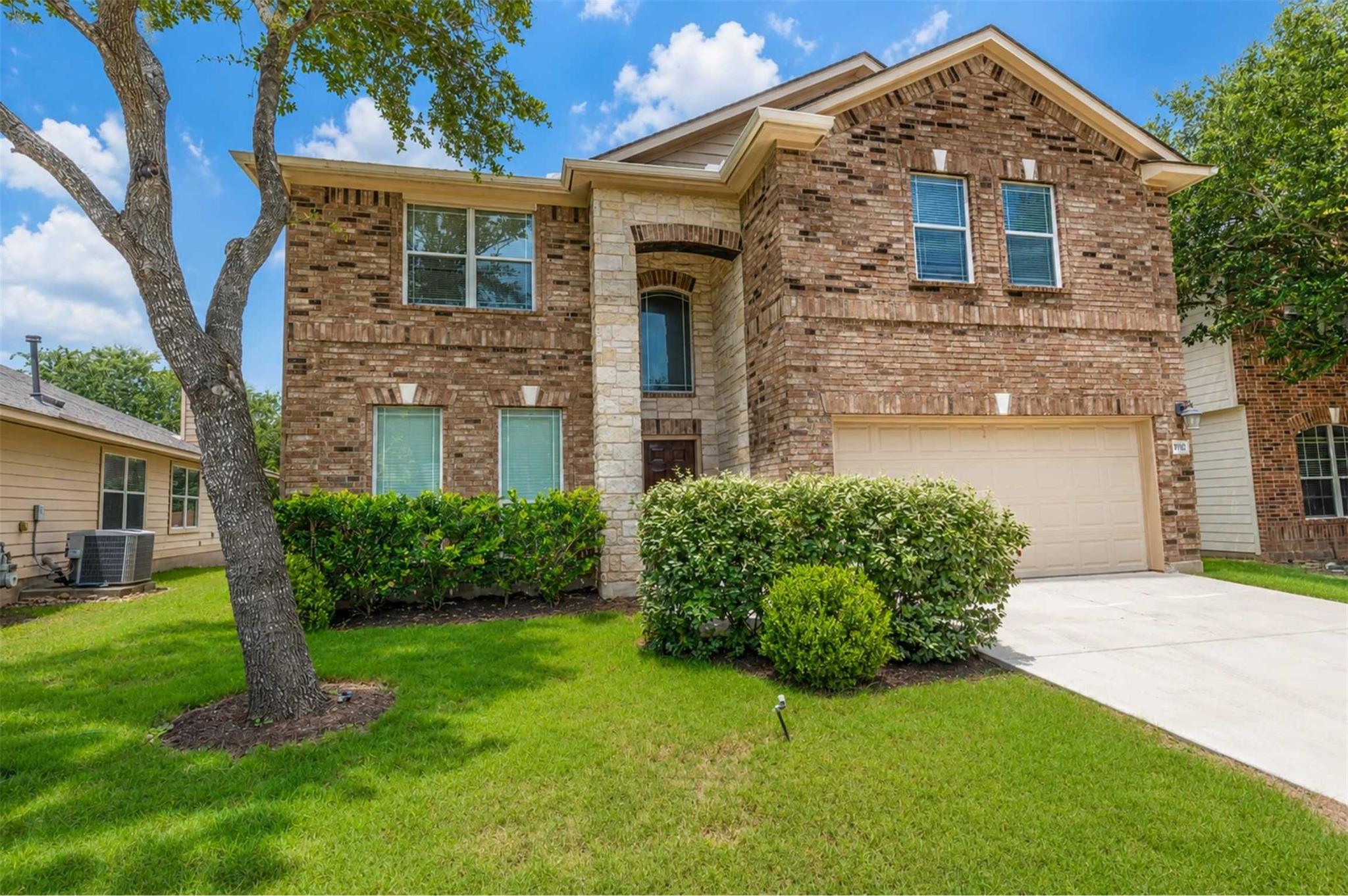 A classic brick exterior with a stone accent entr