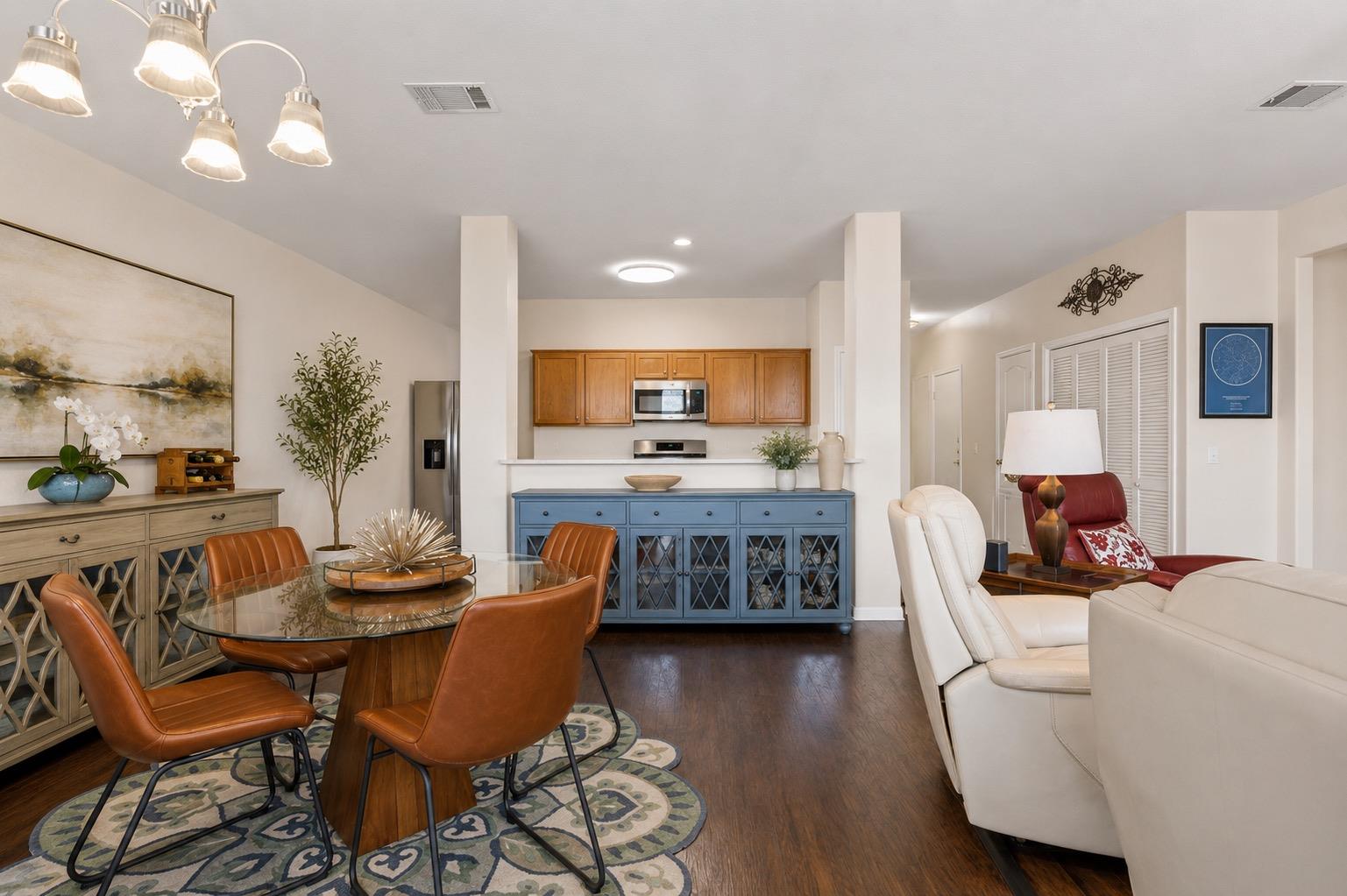 Rich wood flooring flows through this airy, open-