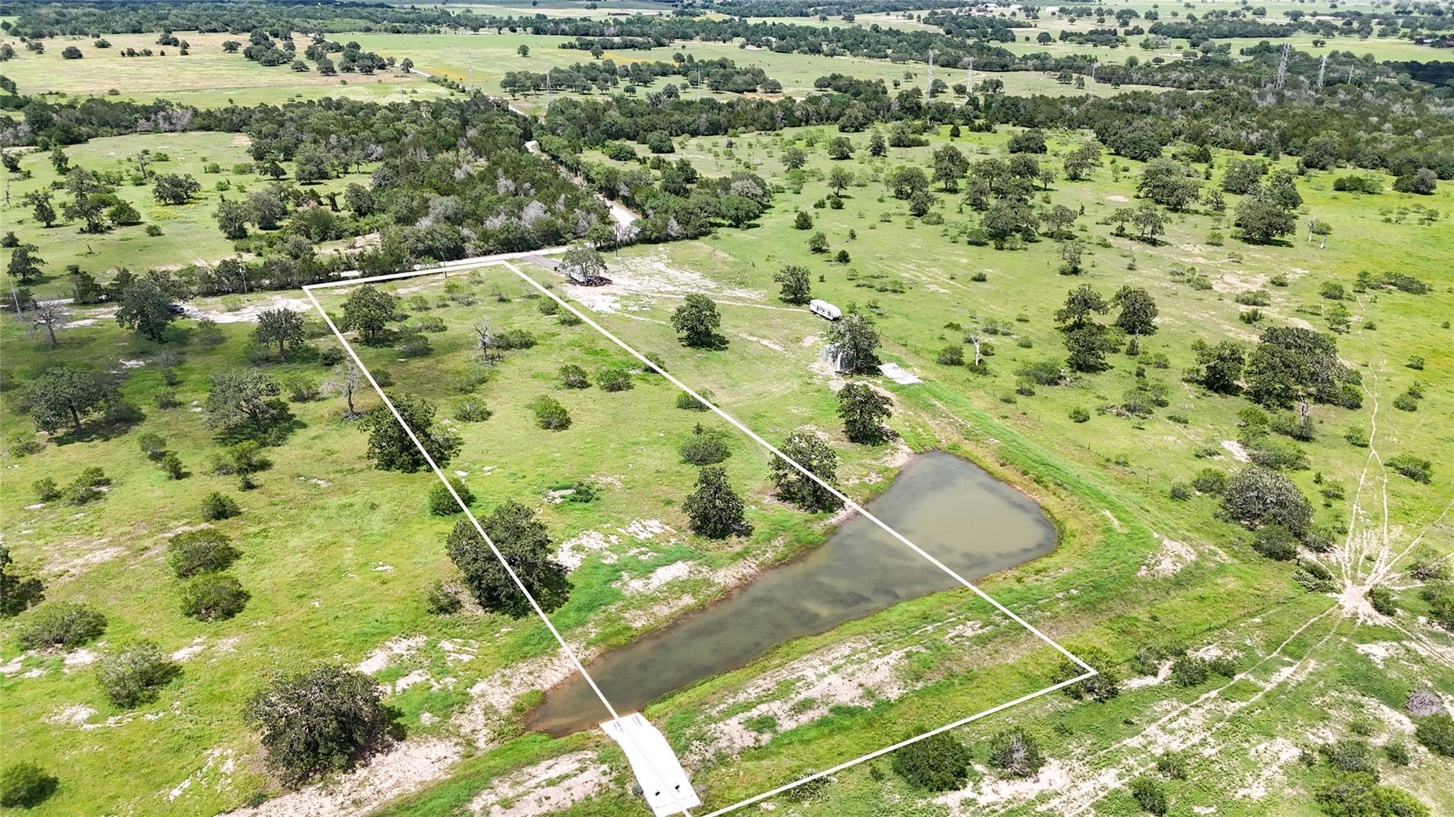 A tranquil rural landscape featuring a natural po