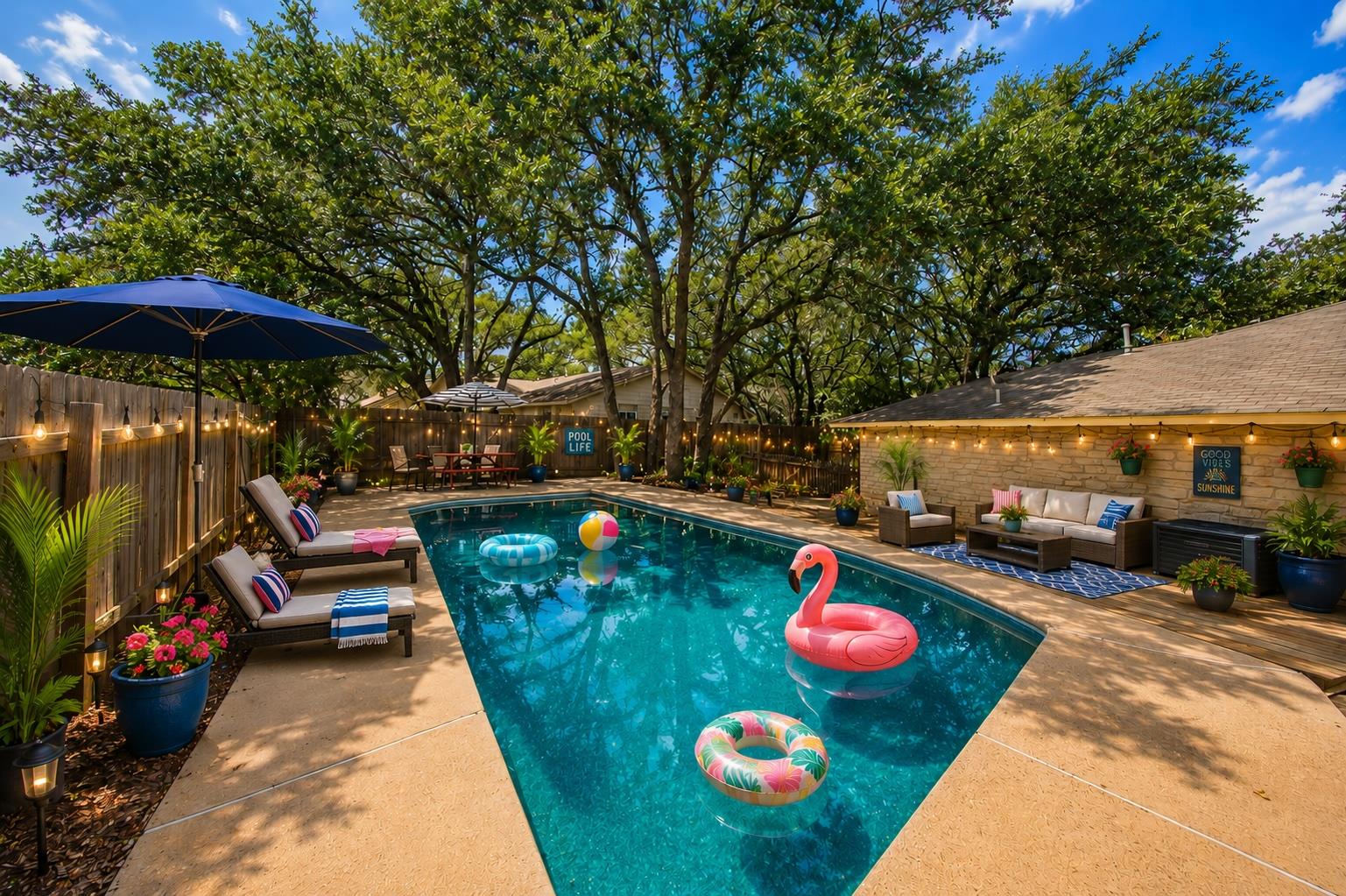 An inviting backyard oasis features a shimmering 
