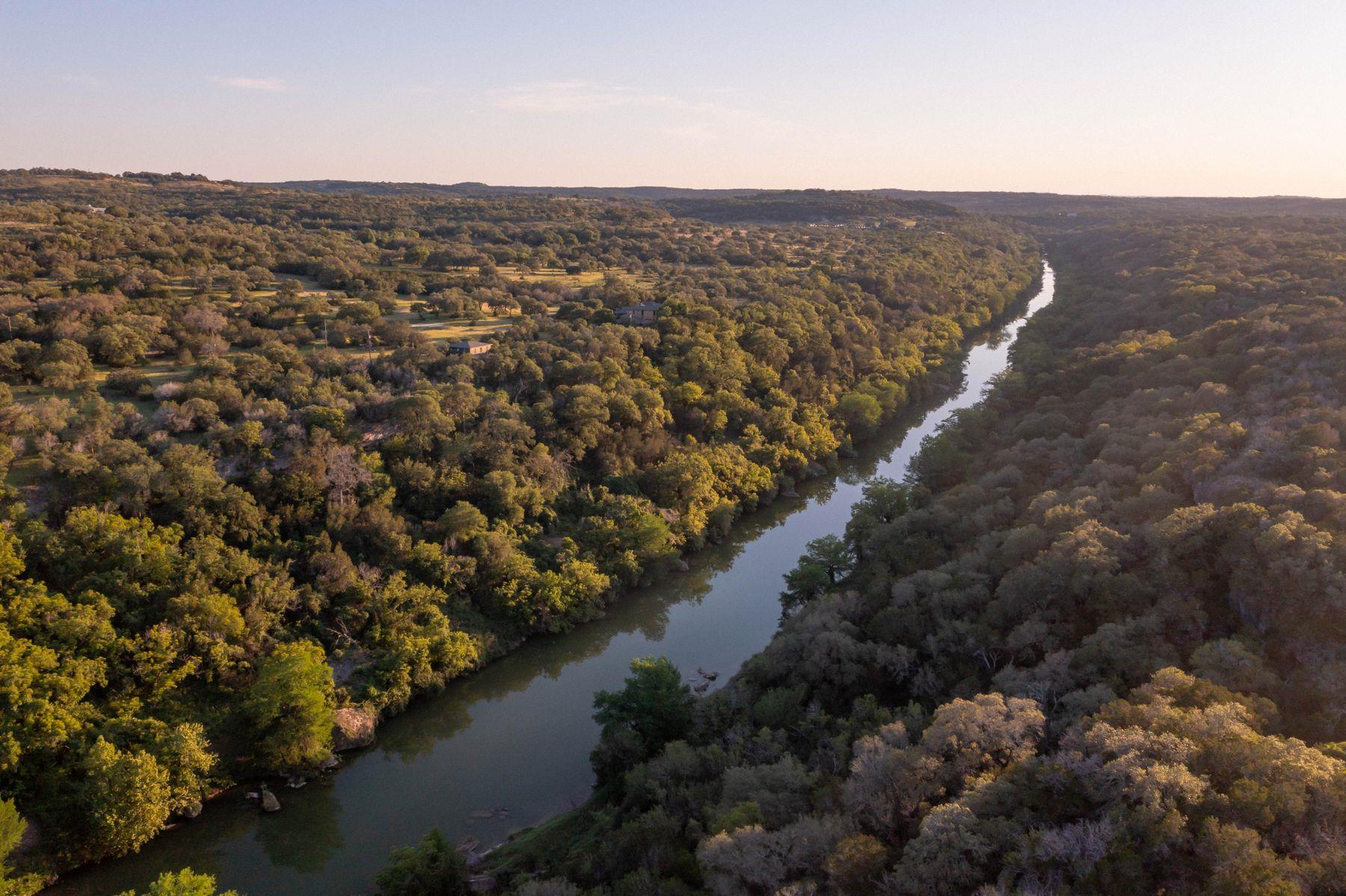 An aerial panorama reveals a meandering river emb