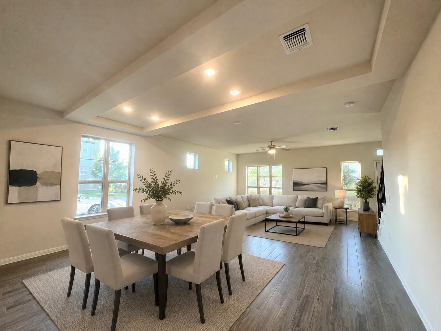 An open concept floorplan features recessed light