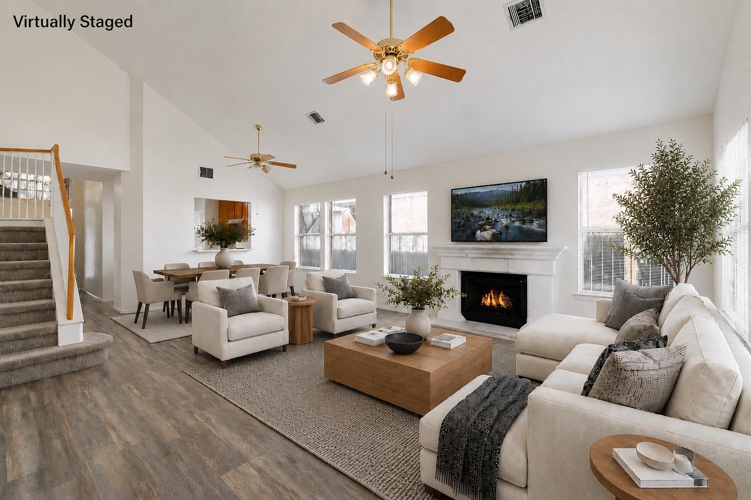 An inviting open-concept living and dining area f