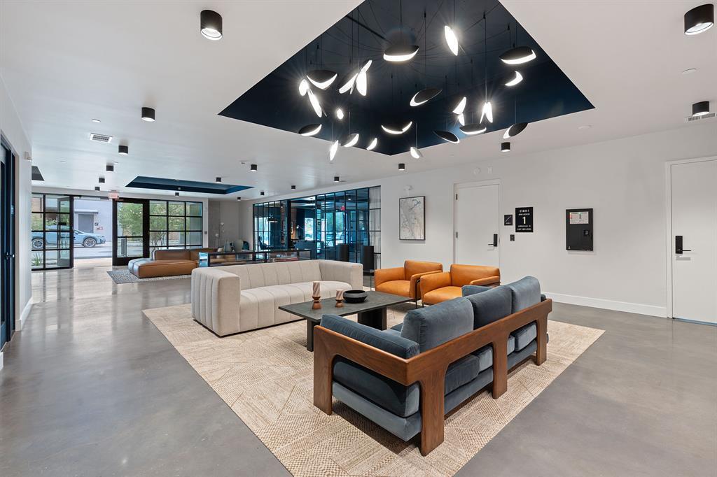 Enter a luminous lobby with modern lighting and d