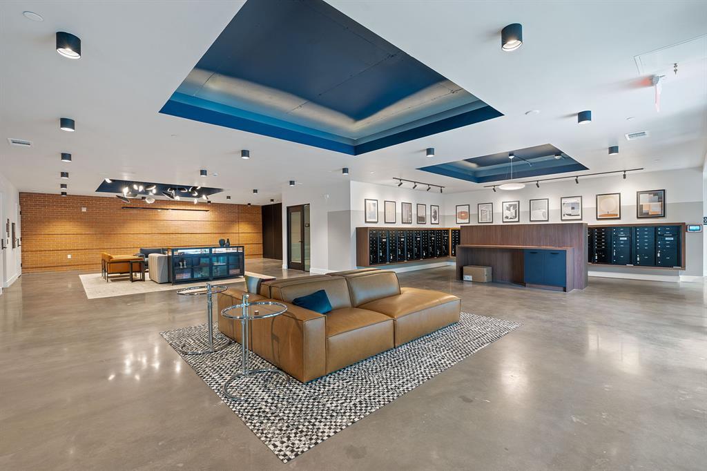 A contemporary lounge space features a bold ceili