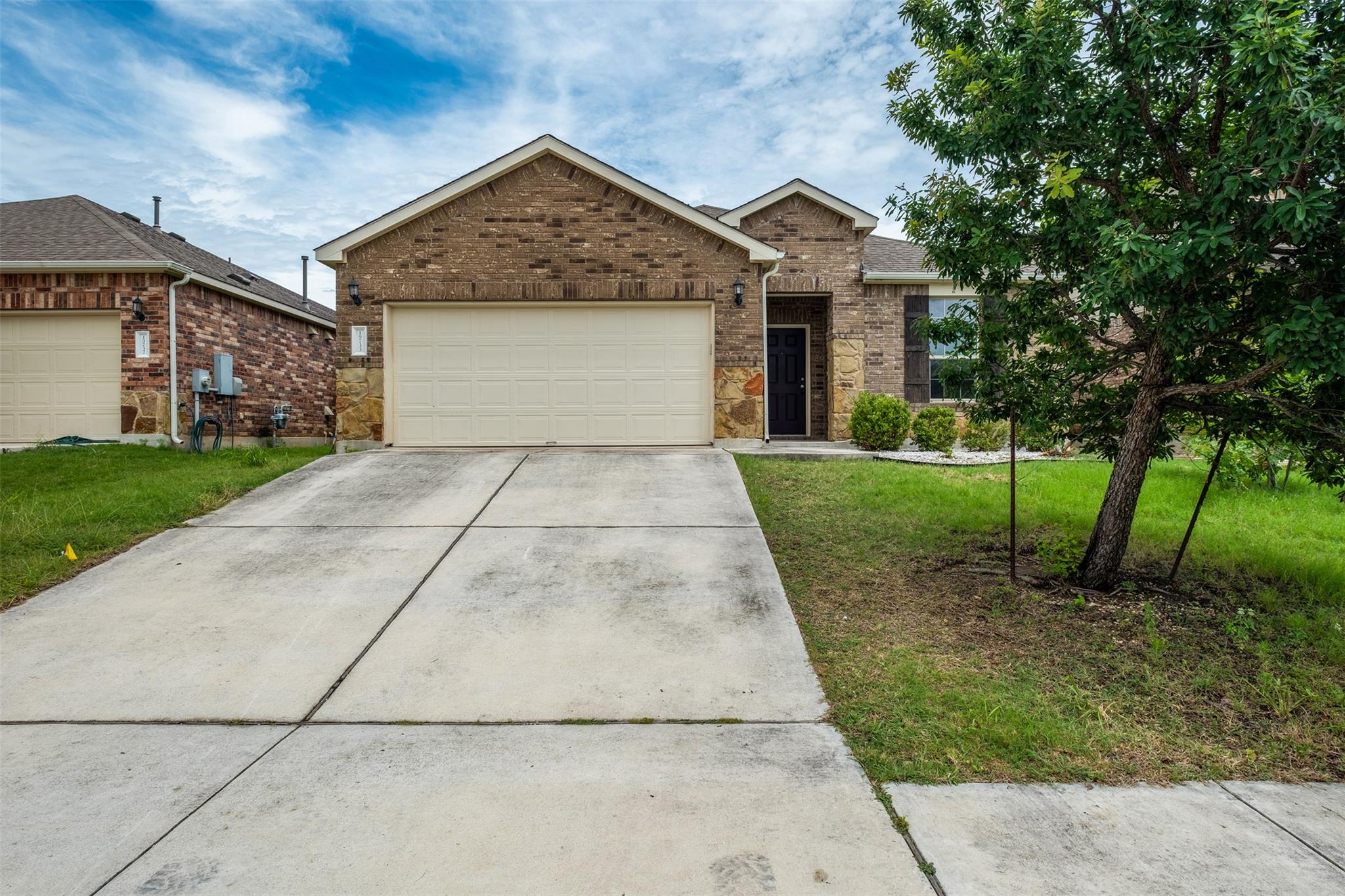 A classic brick exterior with stone accents provi