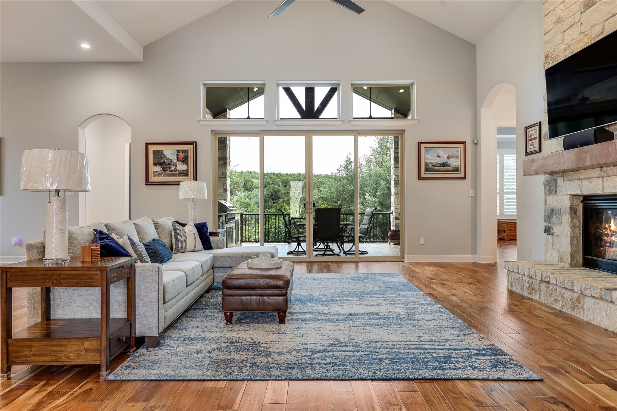 A spacious living area with soaring ceilings and 