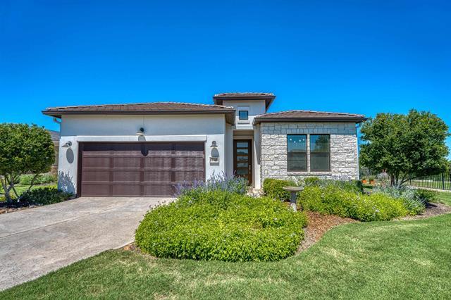 A well-maintained lawn and verdant landscaping en