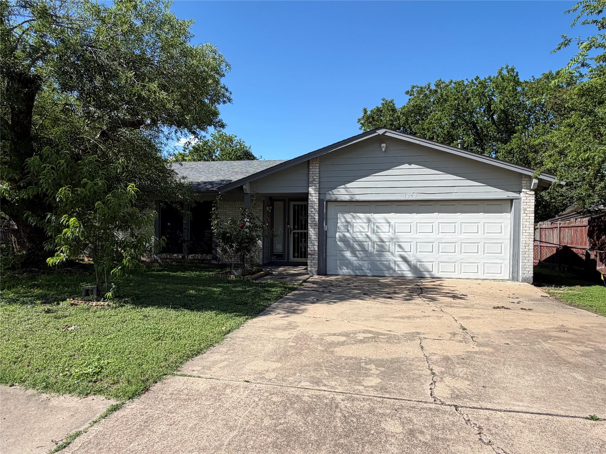 A classic ranch-style home awaits with an attache