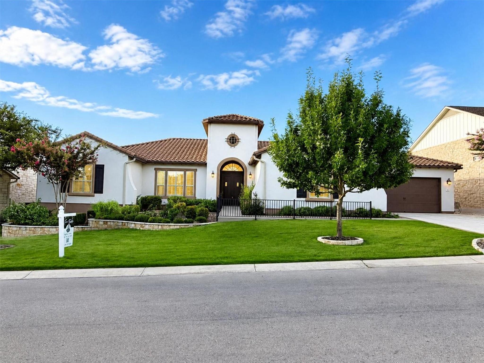 A well-maintained lawn and verdant landscaping co