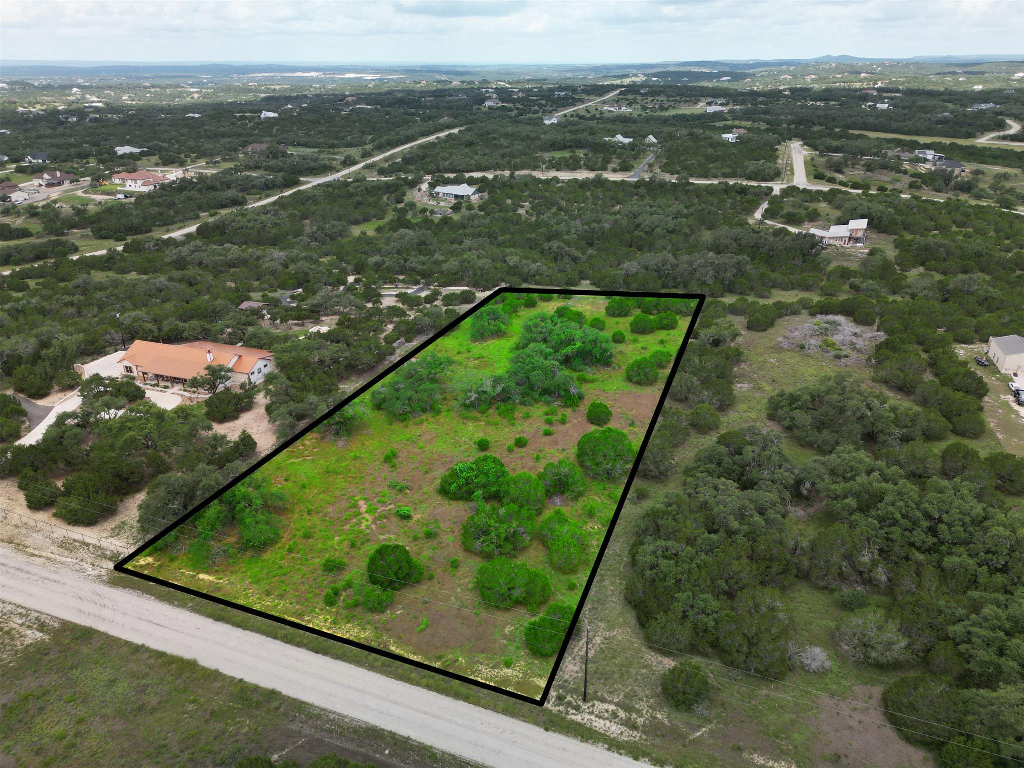 A spacious, undeveloped lot awaits your vision, s