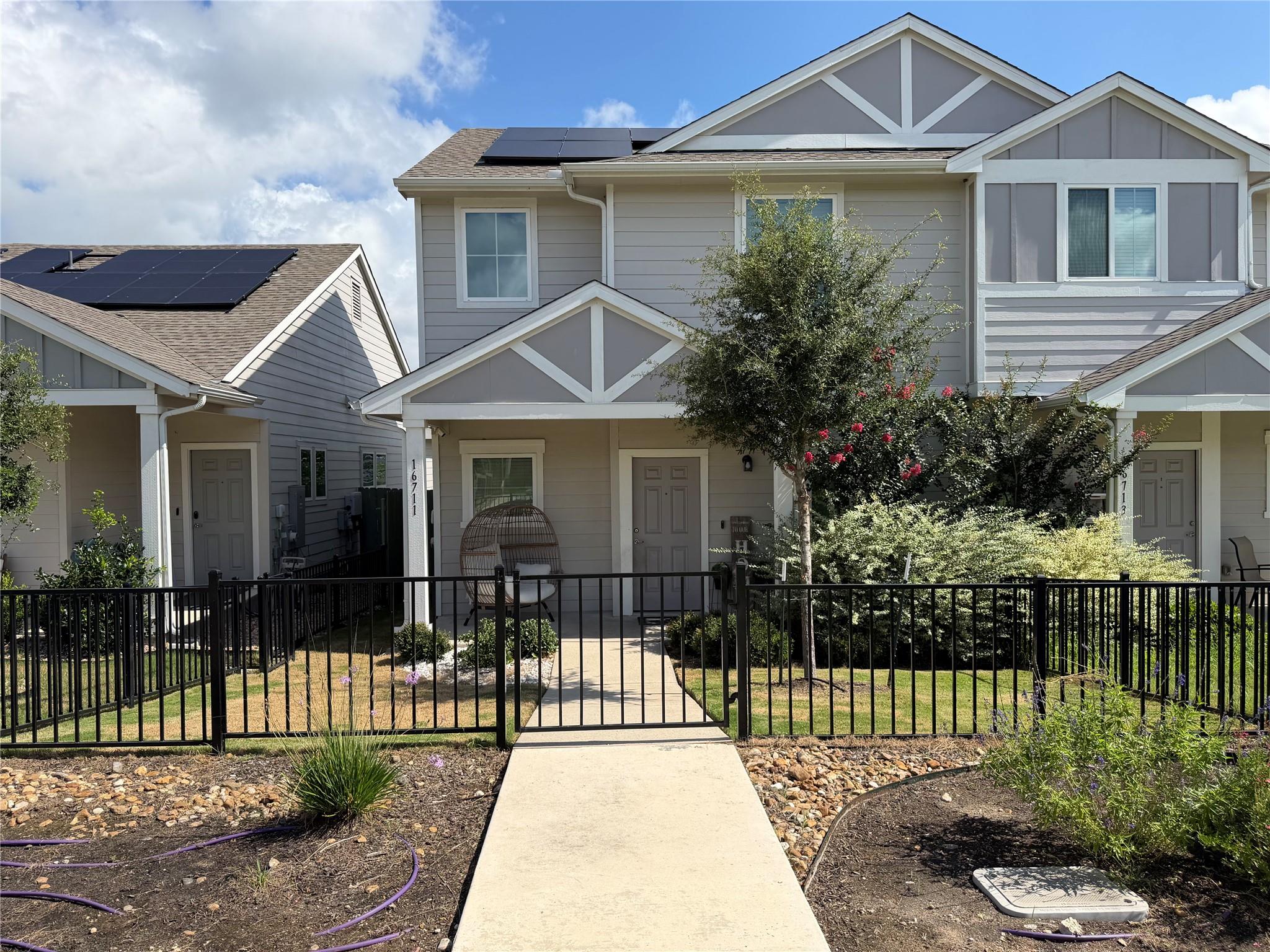 A welcoming walkway leads to this attractive resi