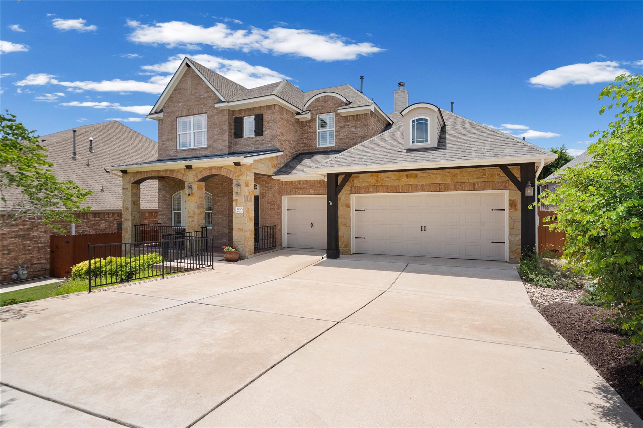 A classic brick and stone facade welcomes you hom