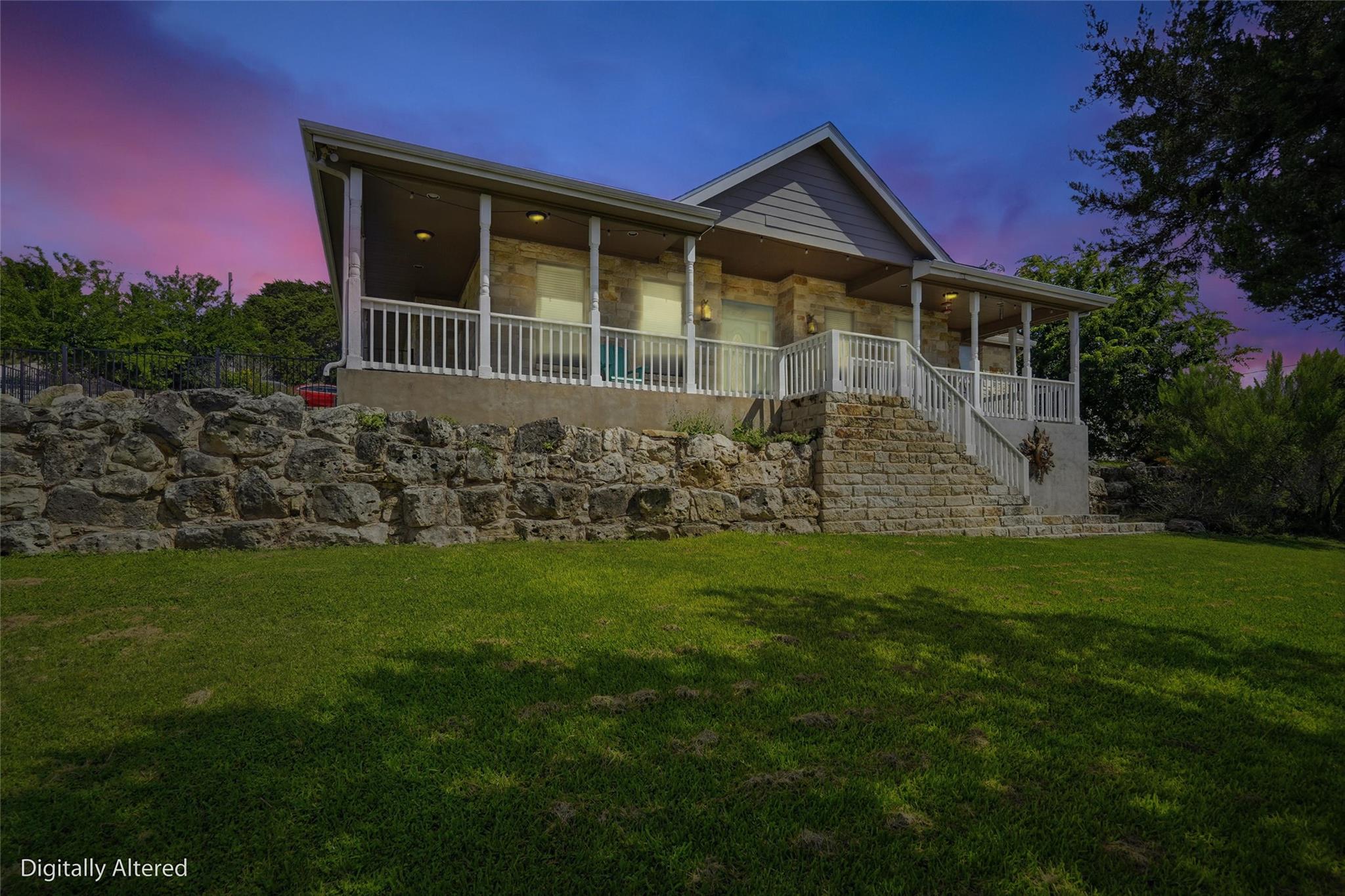 A striking stone and siding residence nestled int
