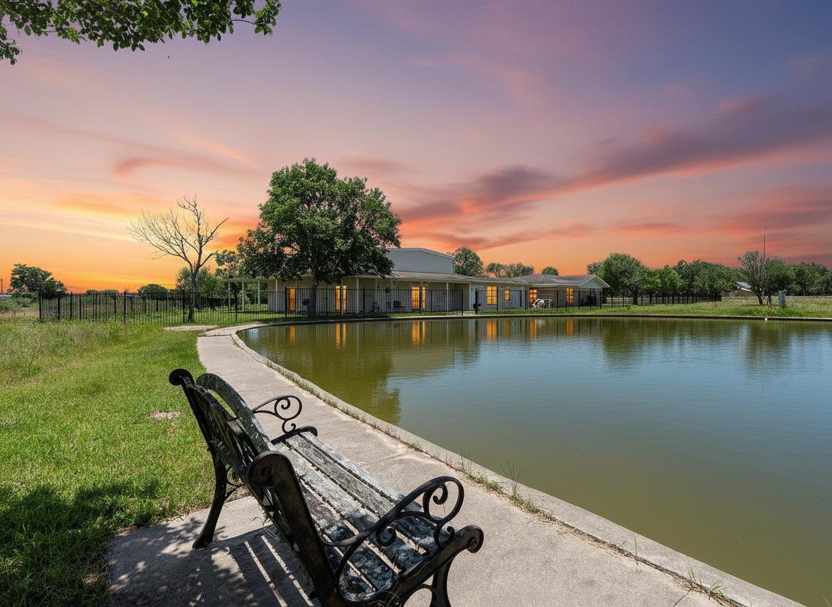 A tranquil pond graces the front of this structur