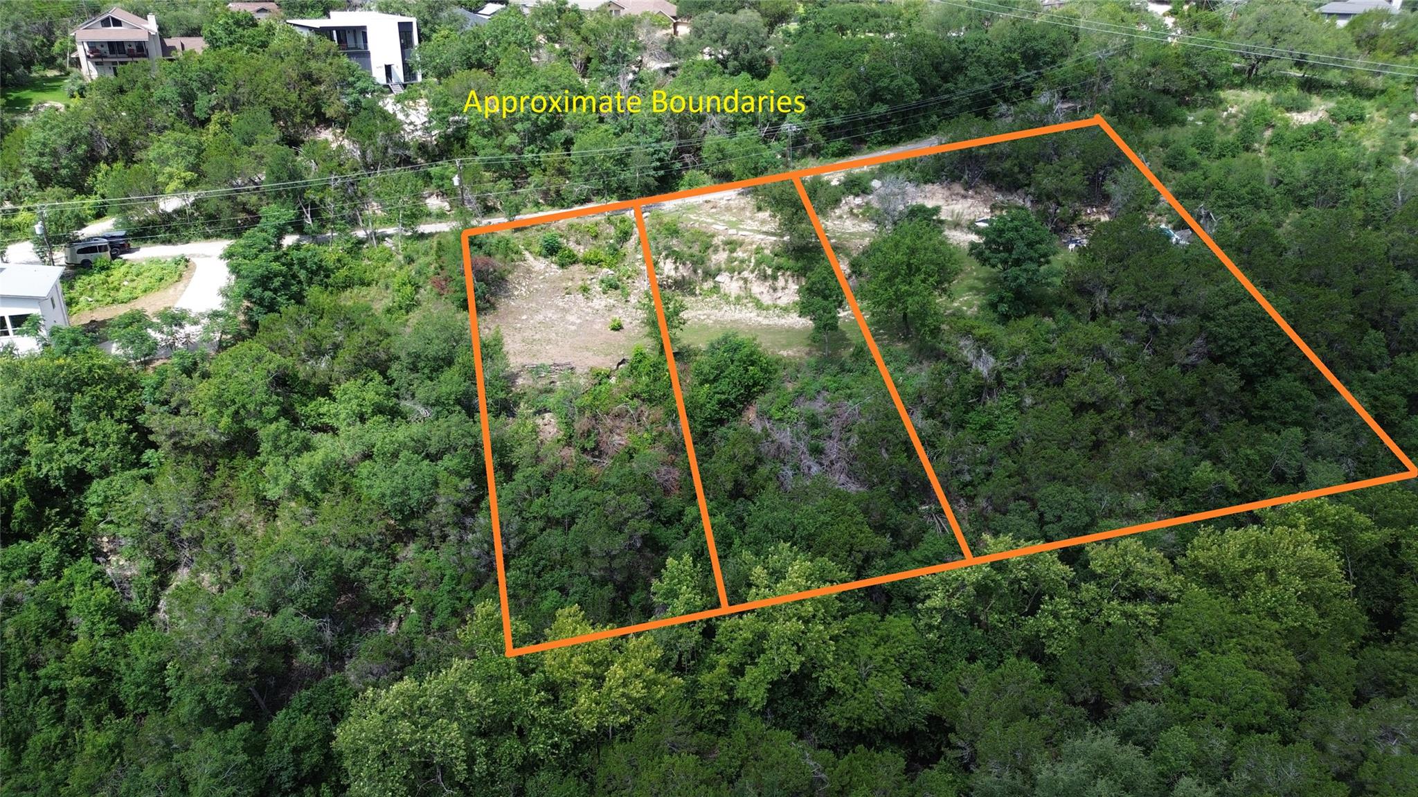A verdant, undeveloped lot outlined with boundari