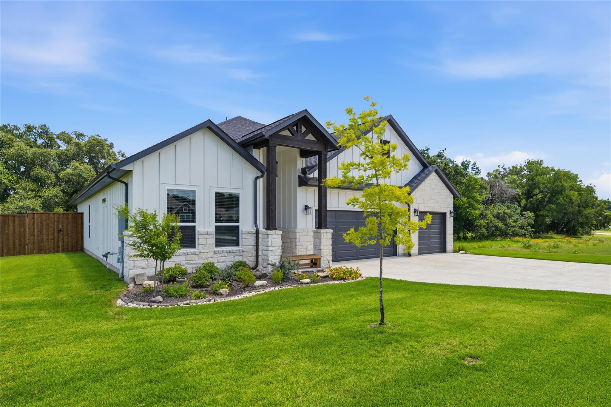 A striking modern farmhouse facade with a welcomi
