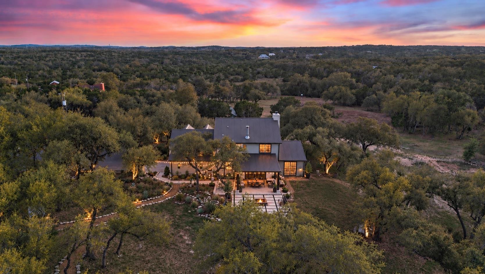 Mature trees surround this modern estate nestled 