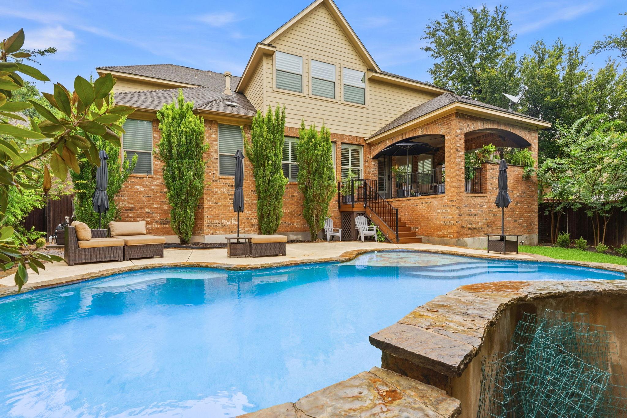 A spacious brick residence with a refreshing swim