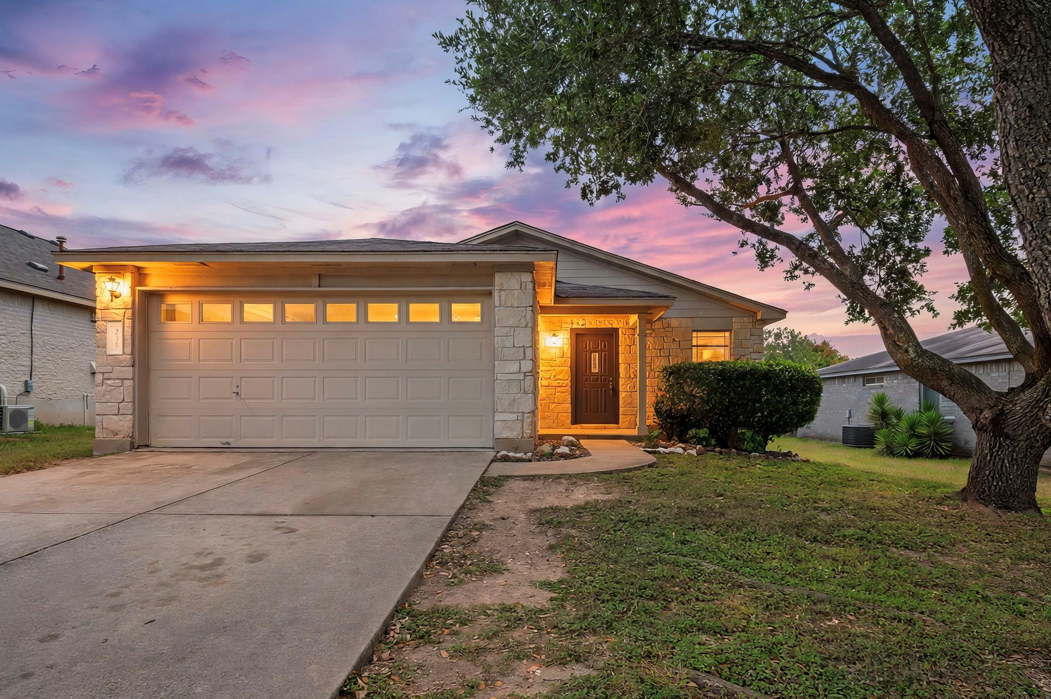 An inviting exterior with a prominent garage and 