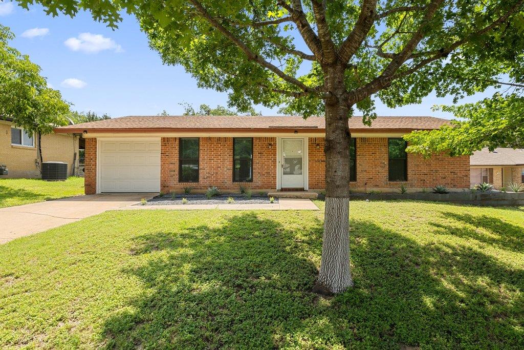 A well-maintained lawn welcomes you to this singl