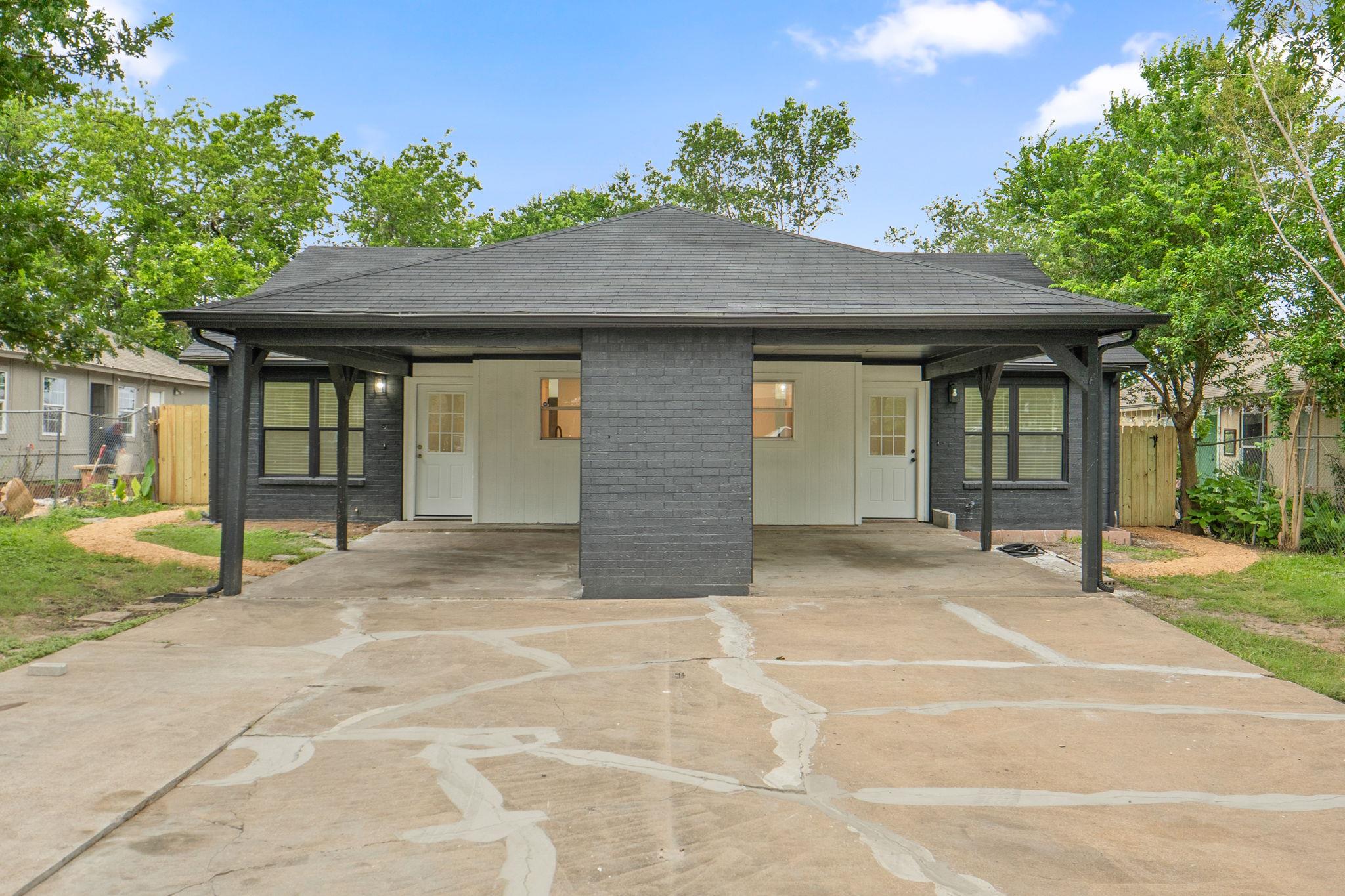 A well-maintained duplex with a covered entry for