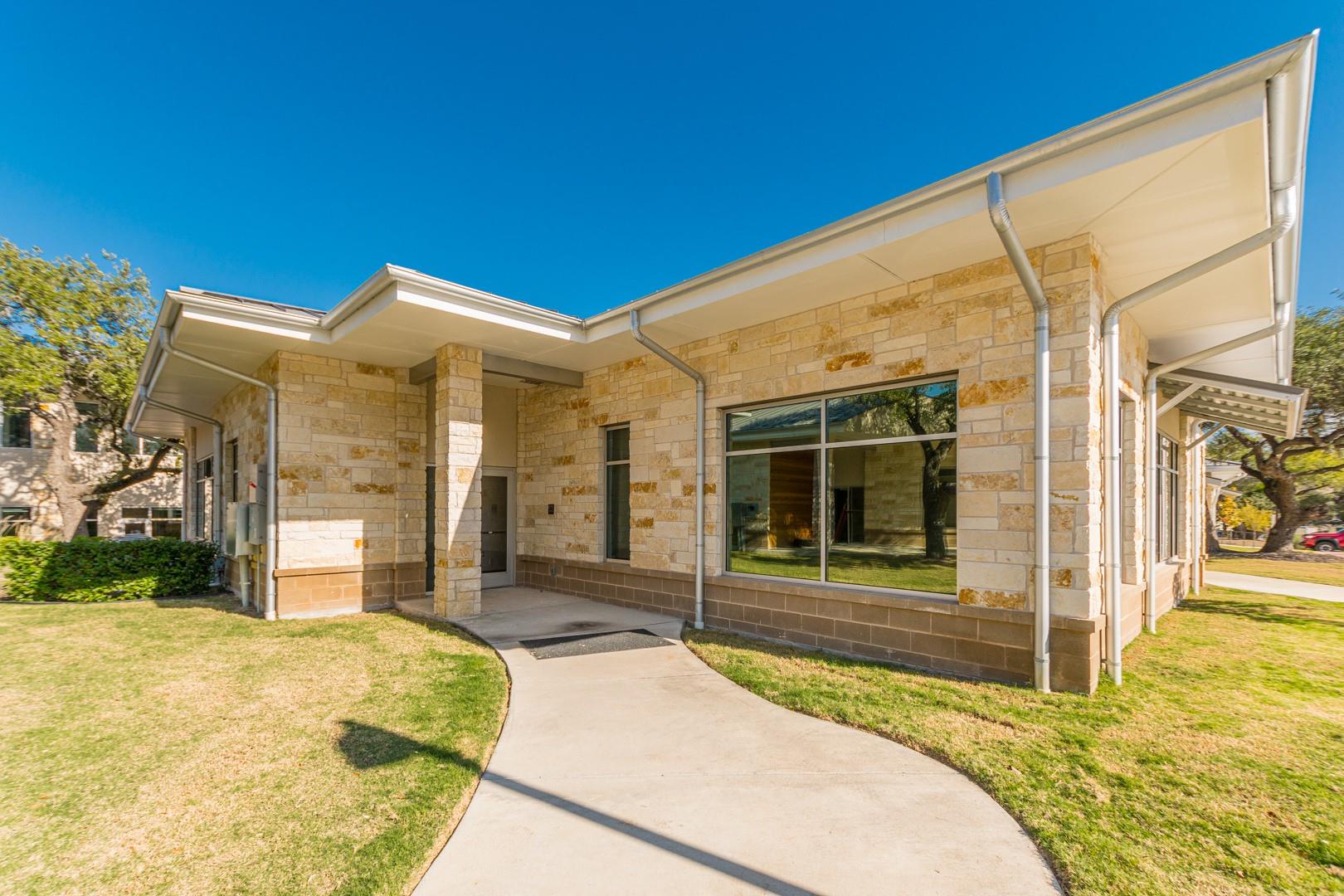A striking modern building with mixed stone mason
