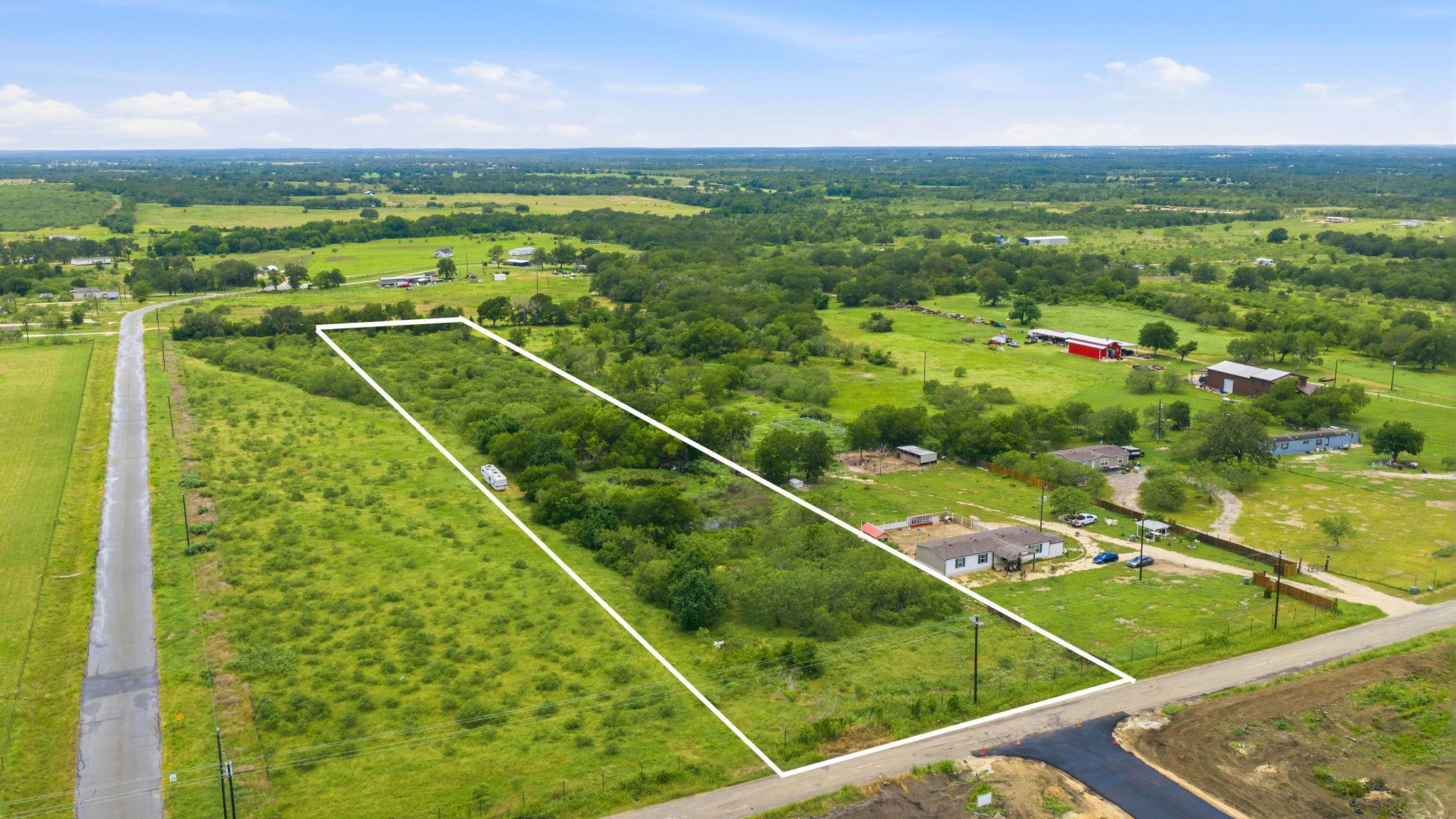 Mature trees and open green spaces define this ex