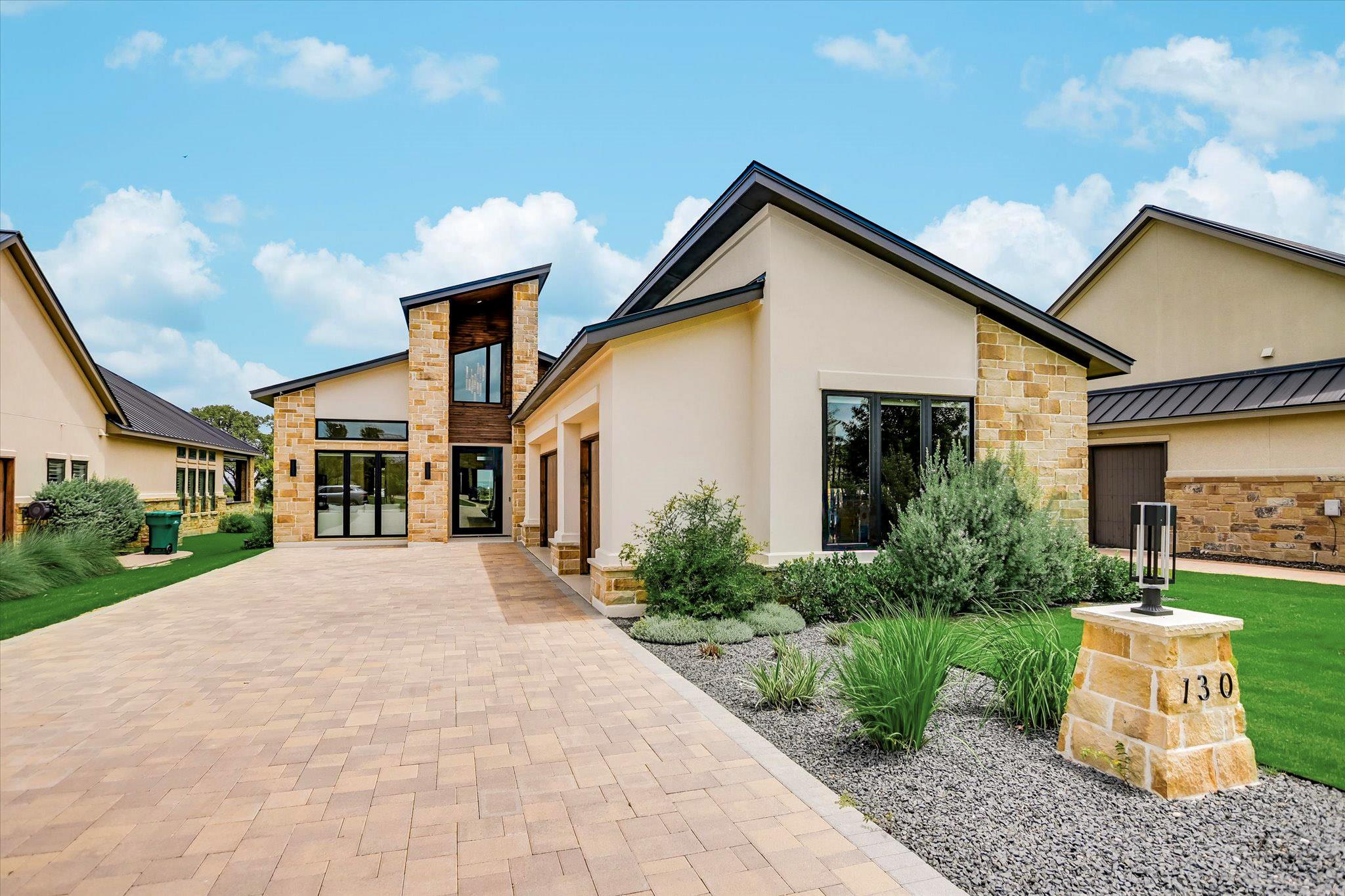 Modern architecture blends stone and stucco, offe