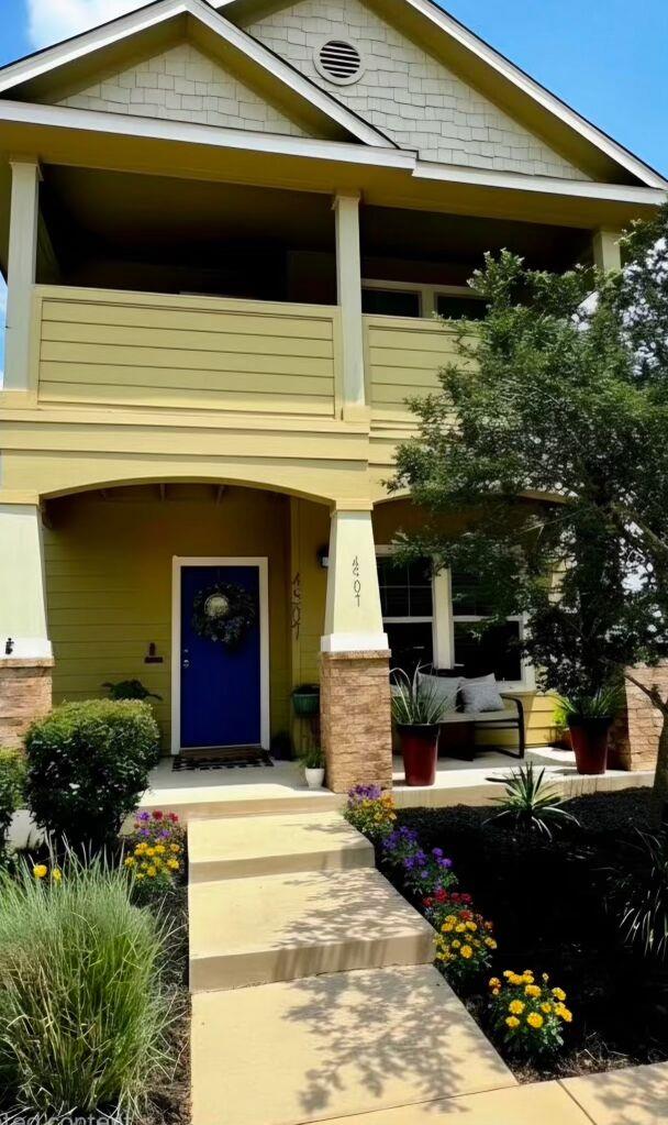 A welcoming front entrance showcases vibrant land