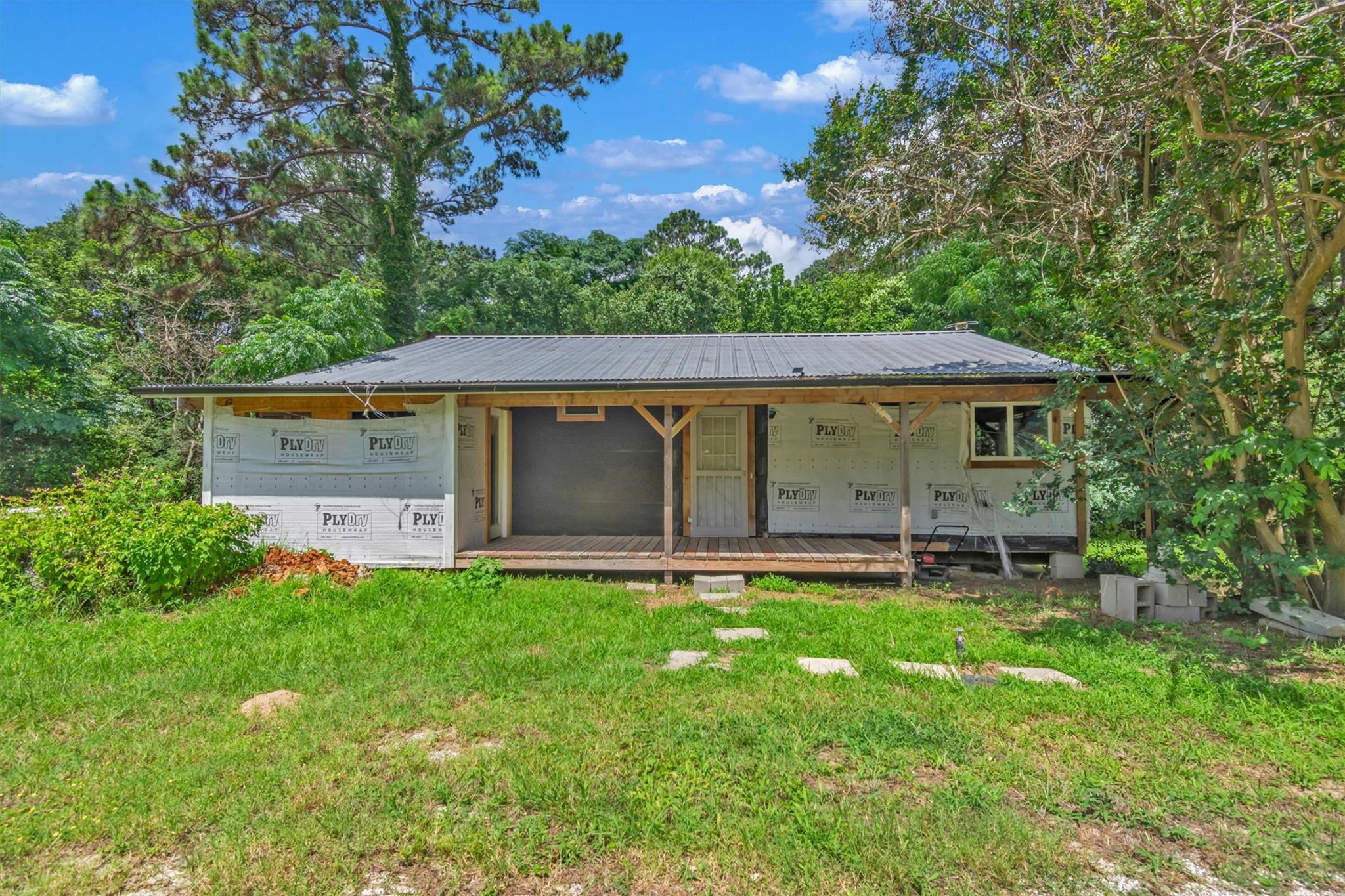 A charming fixer-upper awaits amidst natural land