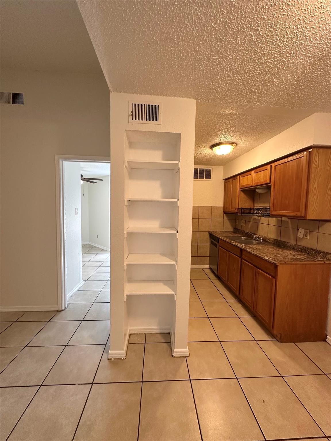 Functional kitchen with ample cabinet space, an i