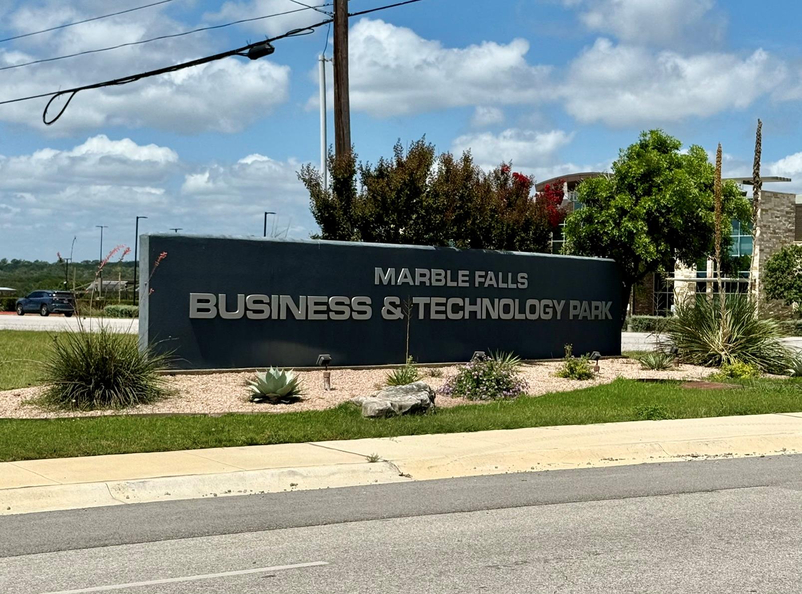A prominent sign welcomes visitors to the Marble 
