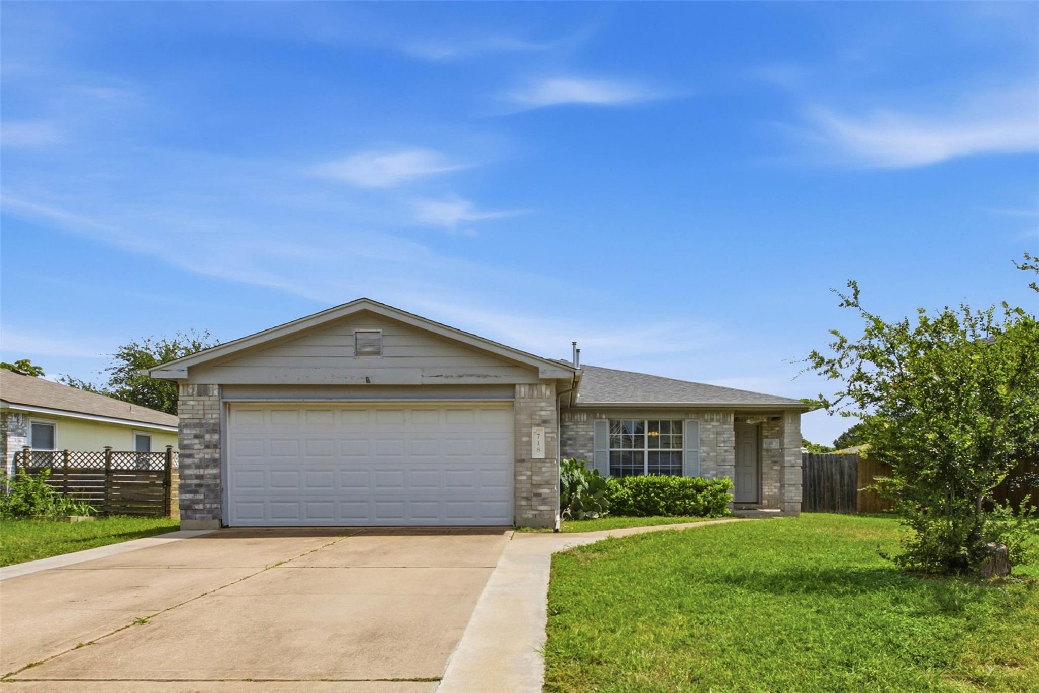A classic facade with a single-car garage and inv