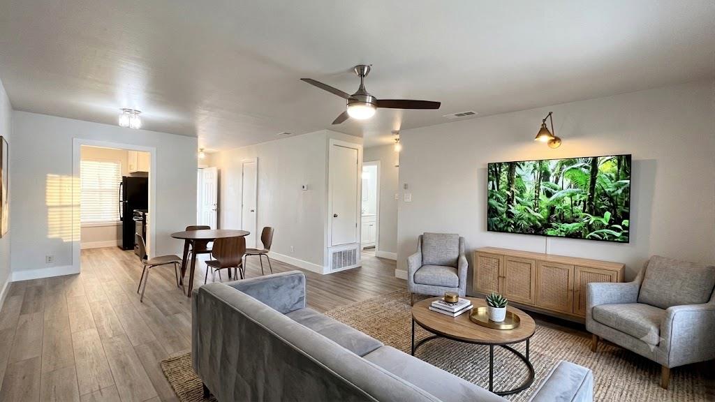 Blended living and dining areas feature light woo